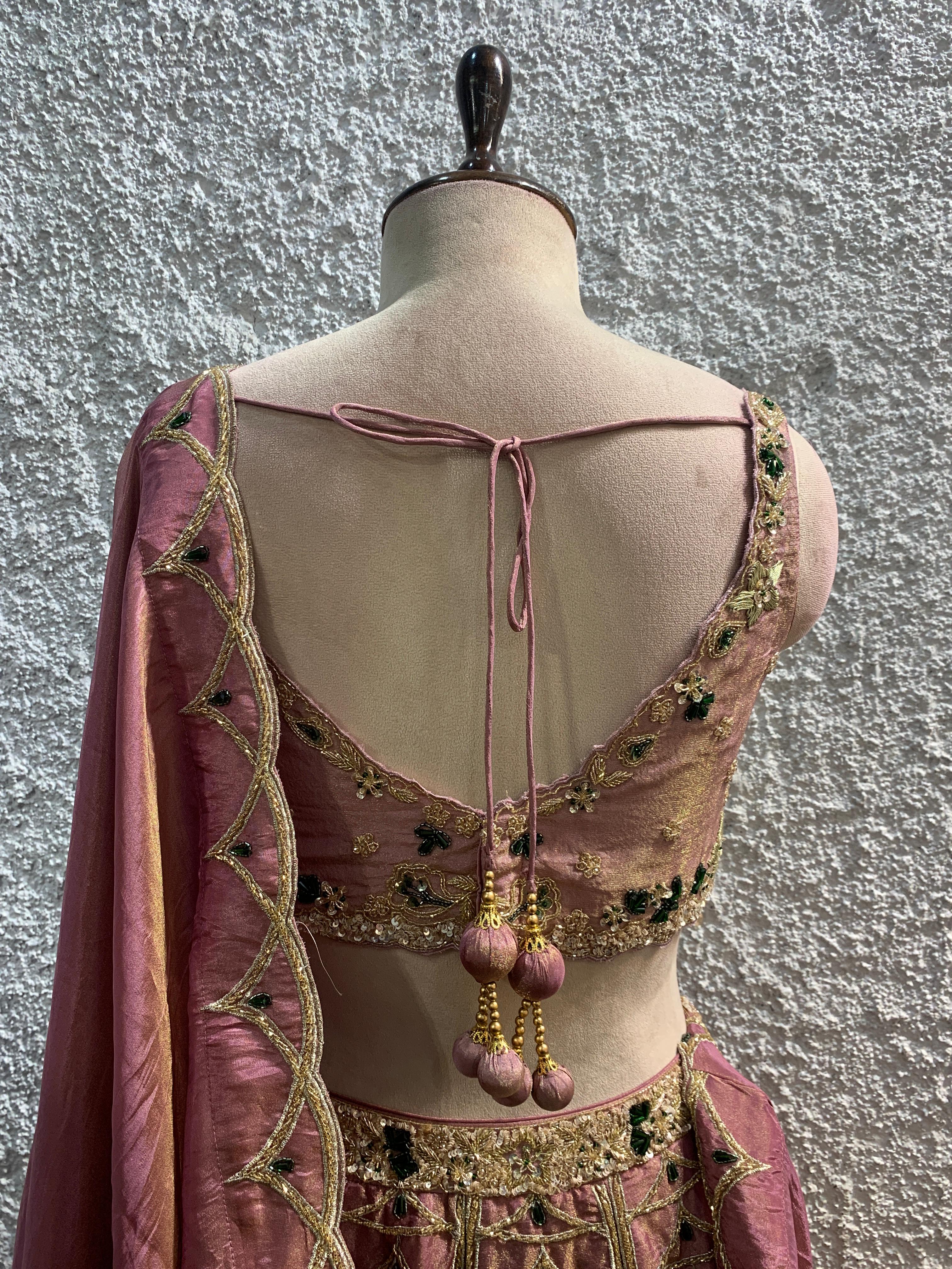 pink shimmer tissue Lehenga with green stone +embroidery lehenga with handwork blouse by OOS – women's ethnic wear – back view