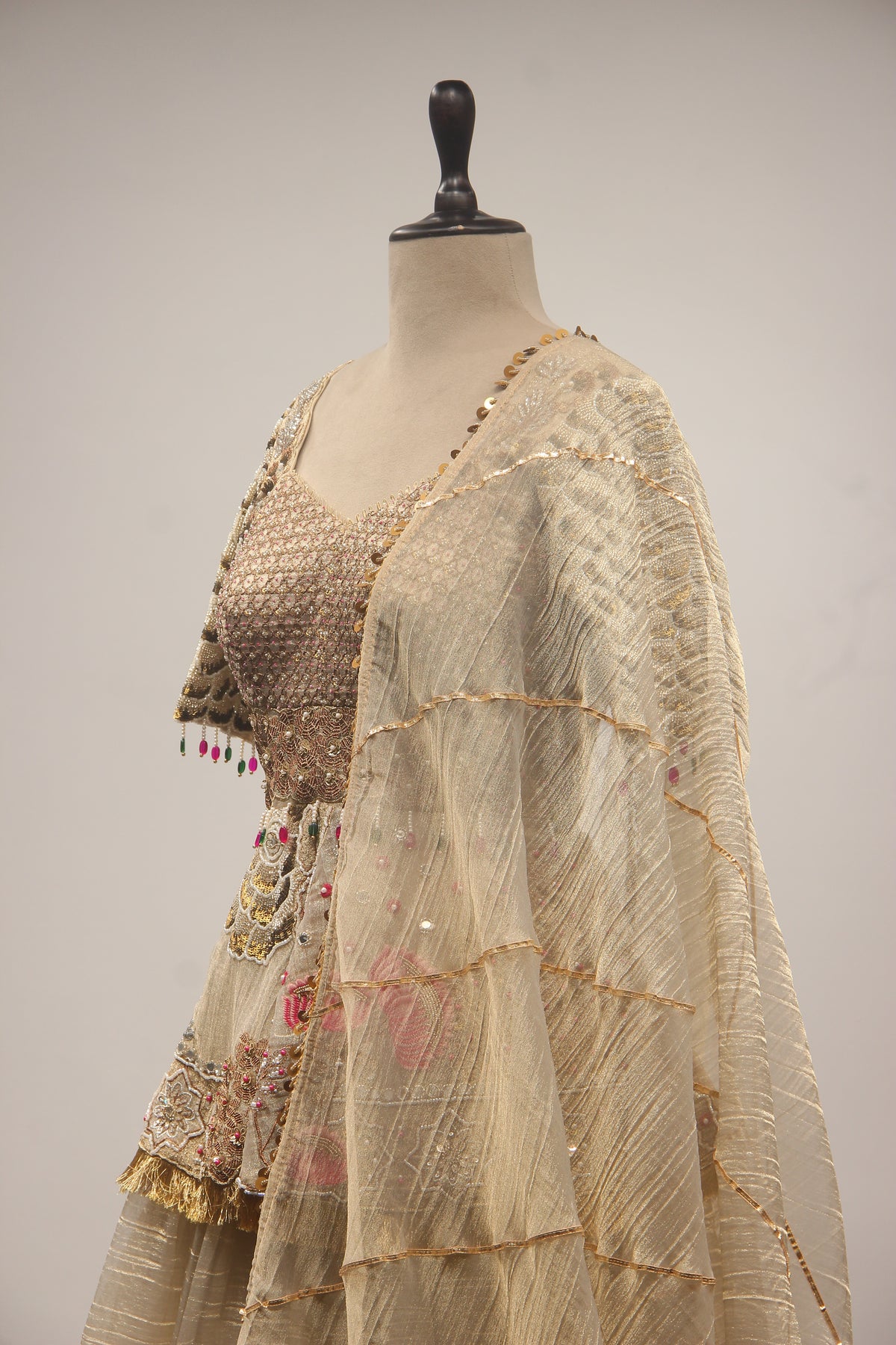 Gold Tissue Lehenga with Peplum Blouse & Cut Dana Bead Handwork