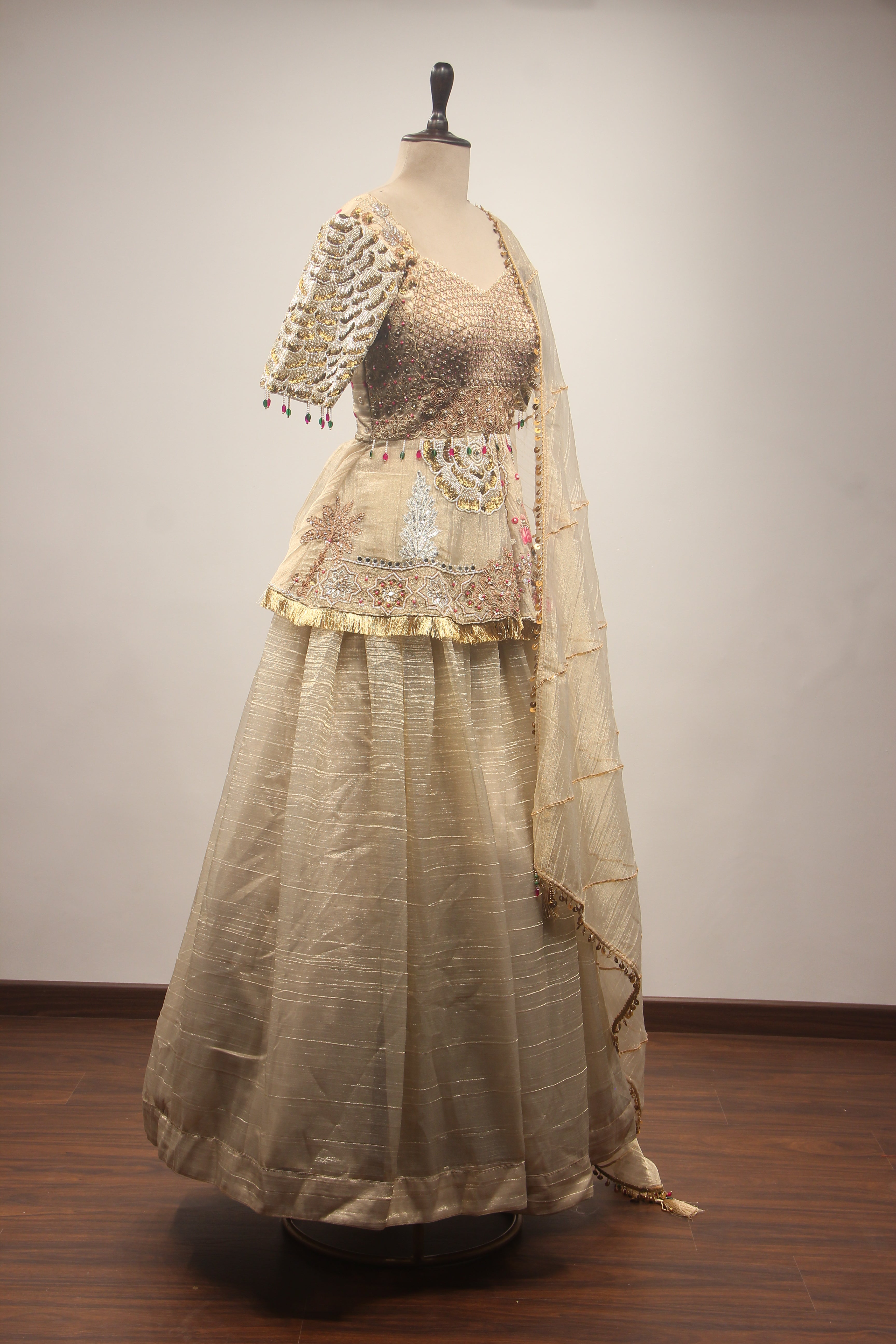 Gold Tissue Lehenga with Peplum Blouse & Cut Dana Bead Handwork