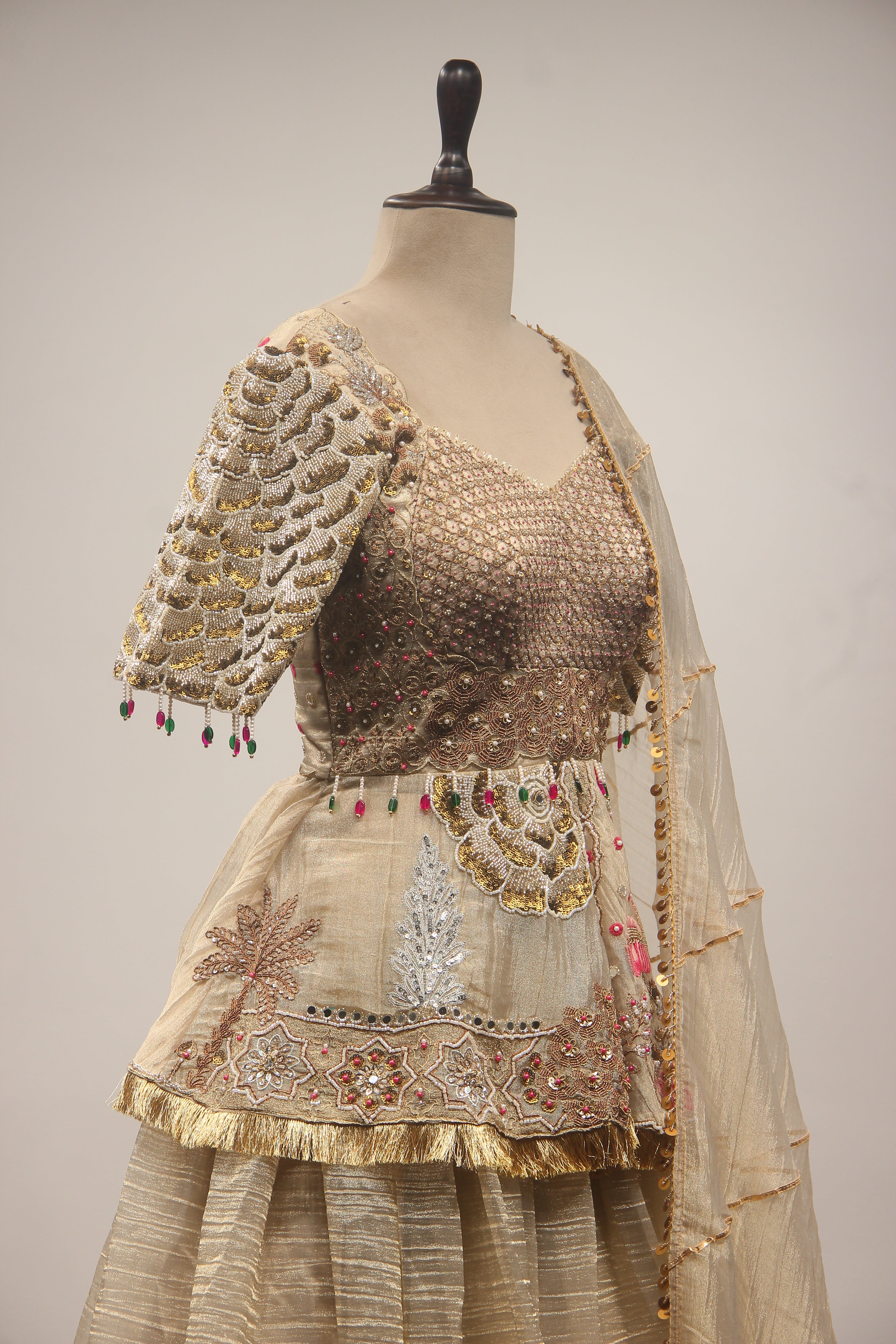 Gold Tissue Lehenga with Peplum Blouse & Cut Dana Bead Handwork