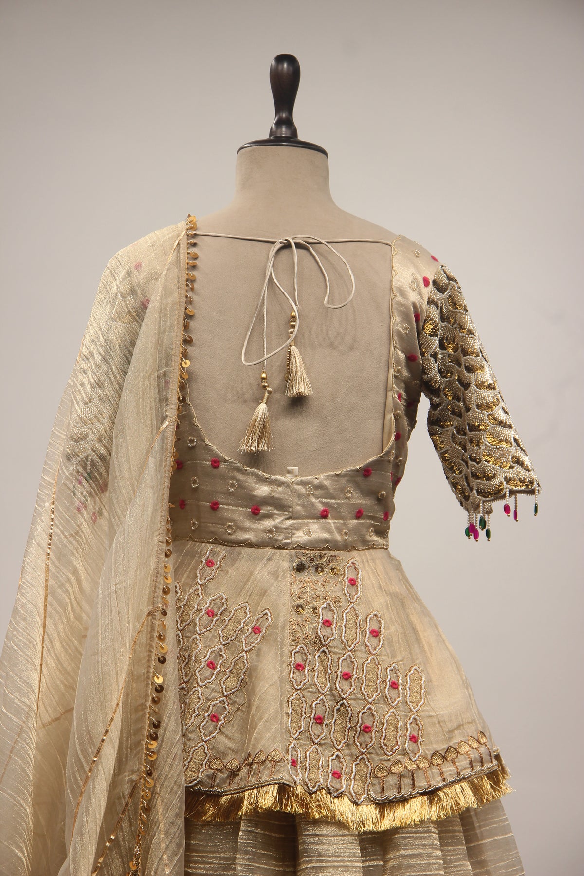 Gold Tissue Lehenga with Peplum Blouse & Cut Dana Bead Handwork