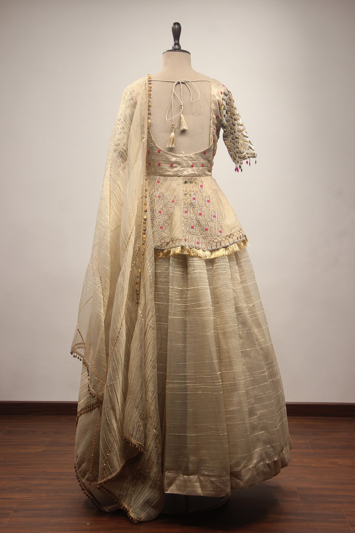 Gold Tissue Lehenga with Peplum Blouse & Cut Dana Bead Handwork