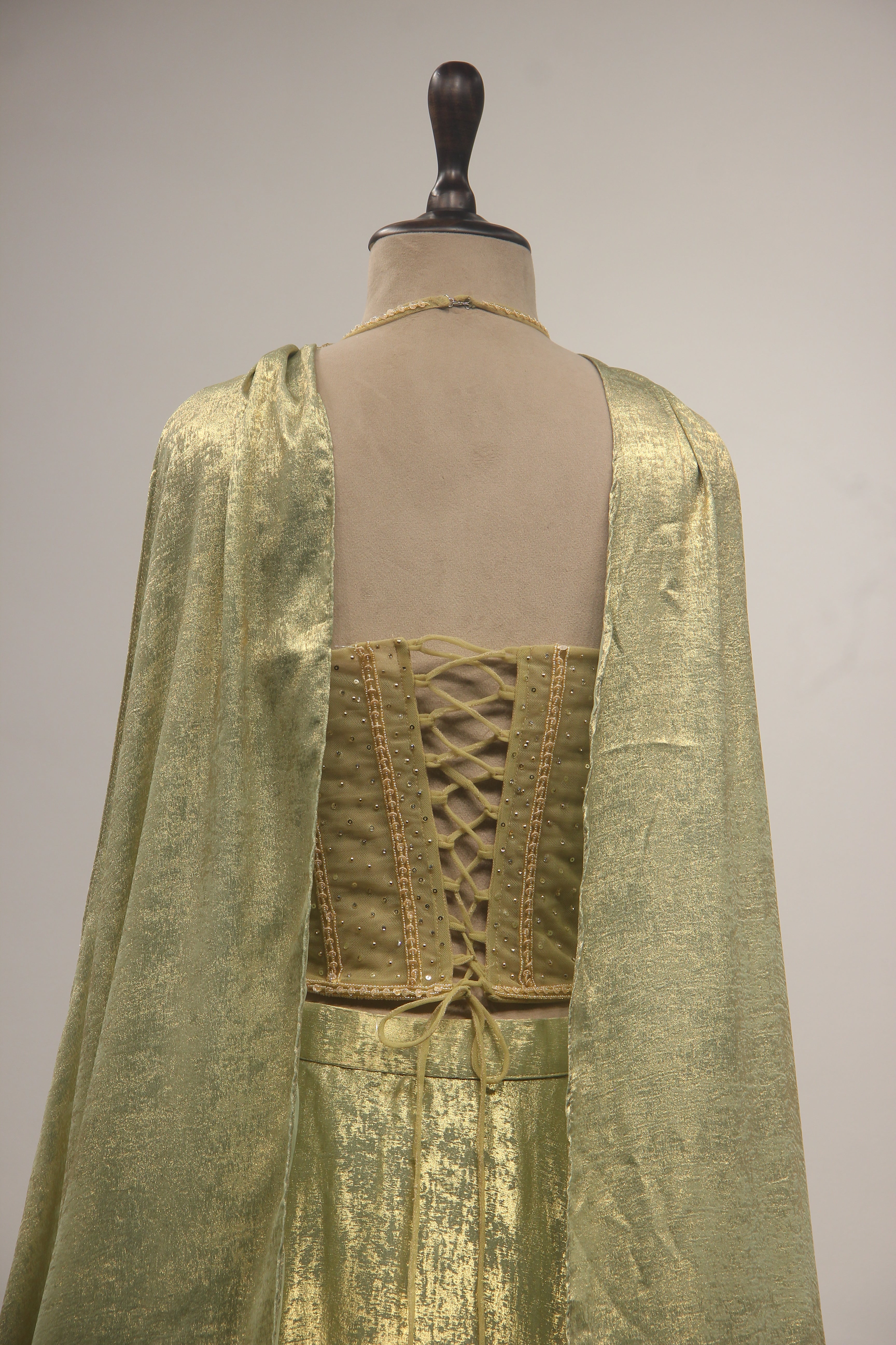 Simmer Lehenga with Halter Corset Blouse & Cut Dana Handwork