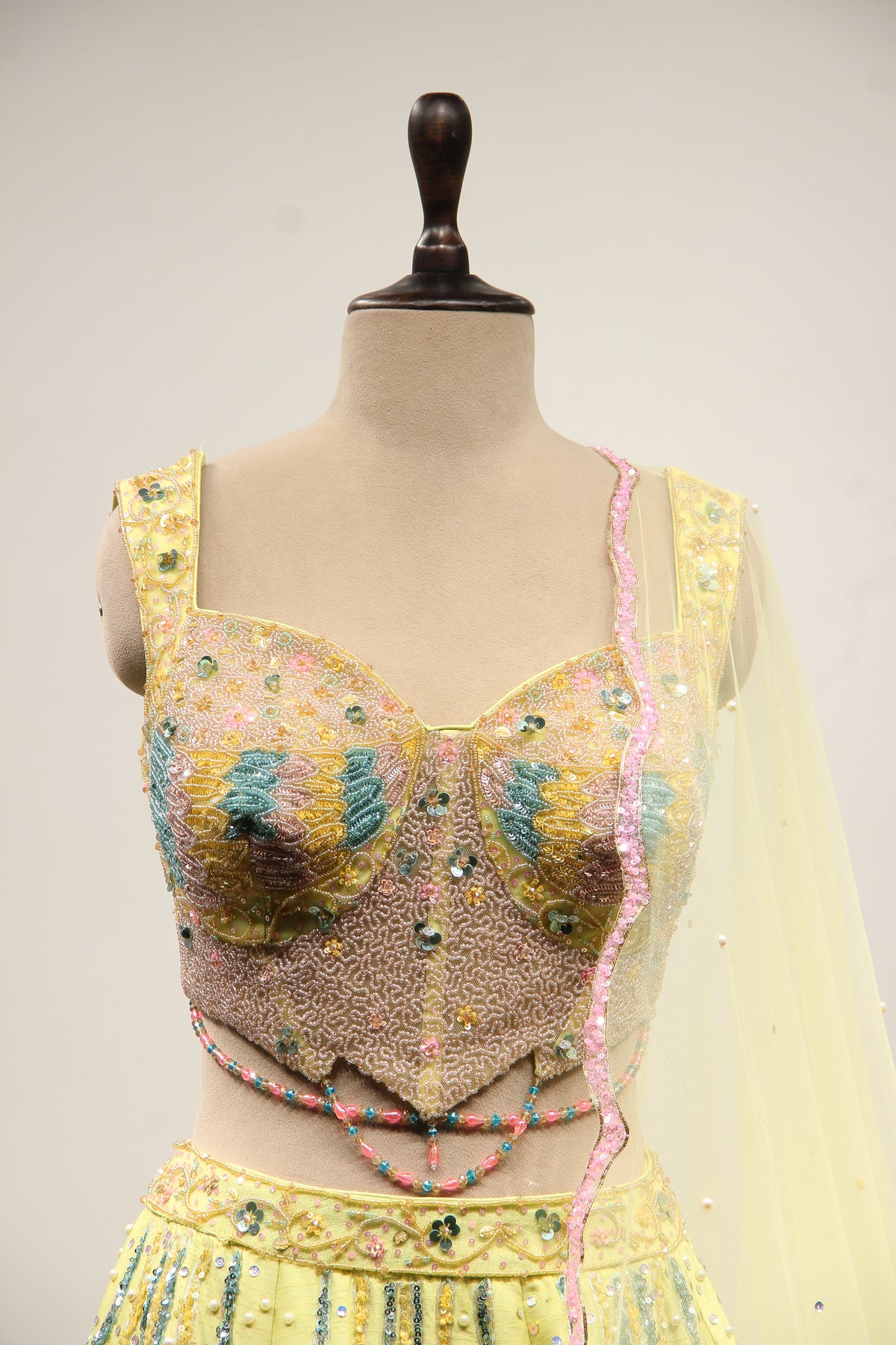 Pista Green Dupion Lehenga with Mirror & Cut Dana Handwork Net Corset – front close-up