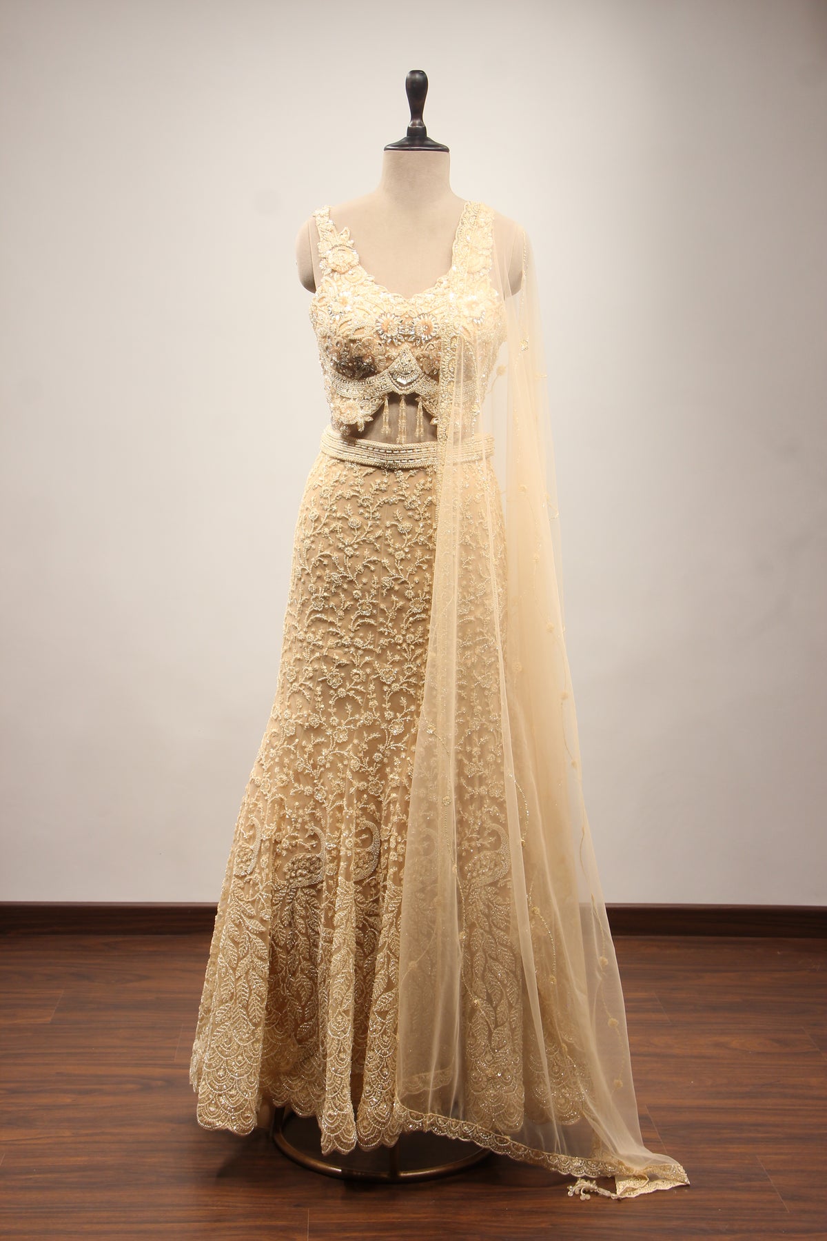 Net Mermaid Lehenga with Sequin & Cut Dana Handwork and Floral Bodice in Gold – front view
