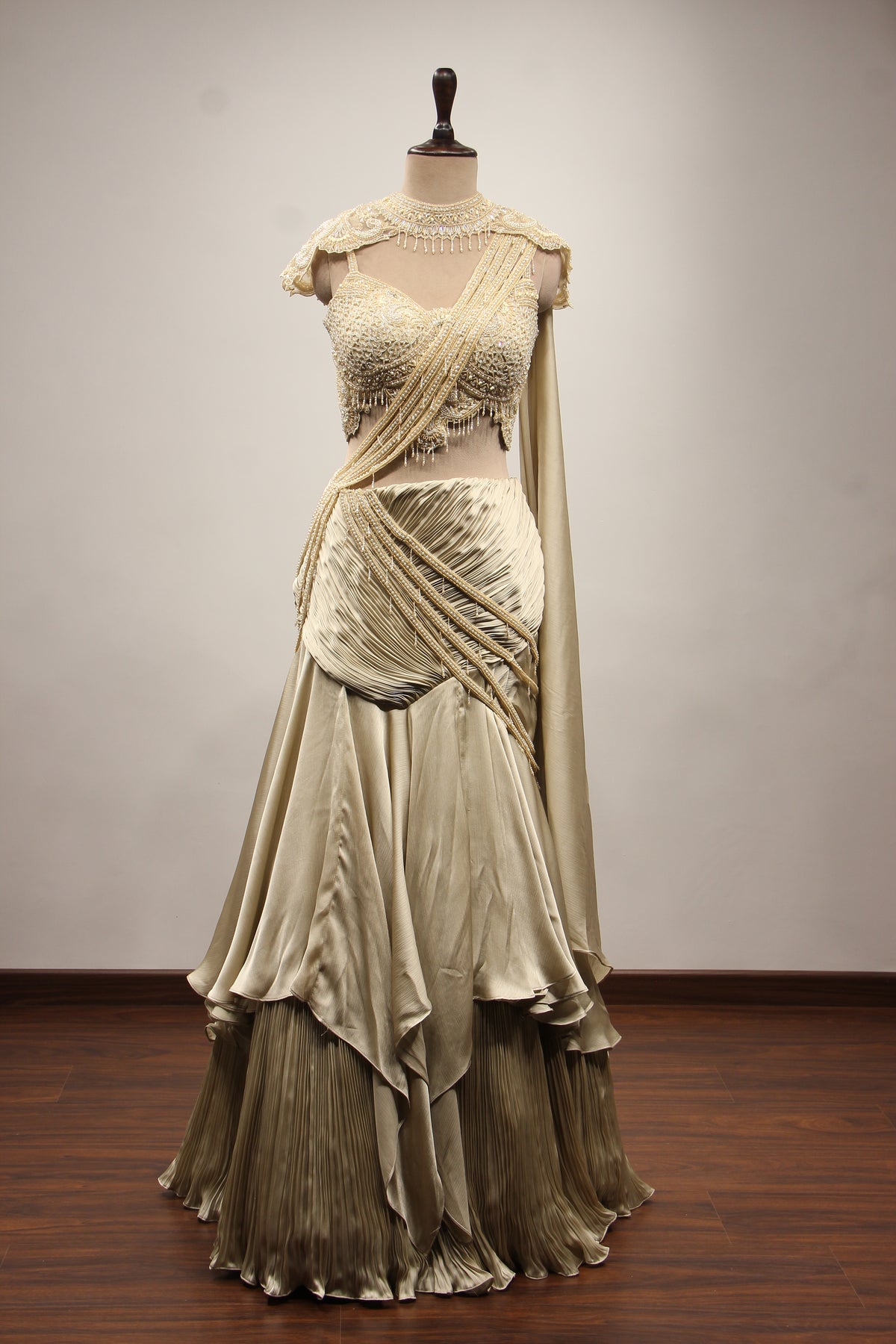Ivory Satin Drape Skirt Lehenga with Bead & Pearl Handwork Crop Top – front view, with cape