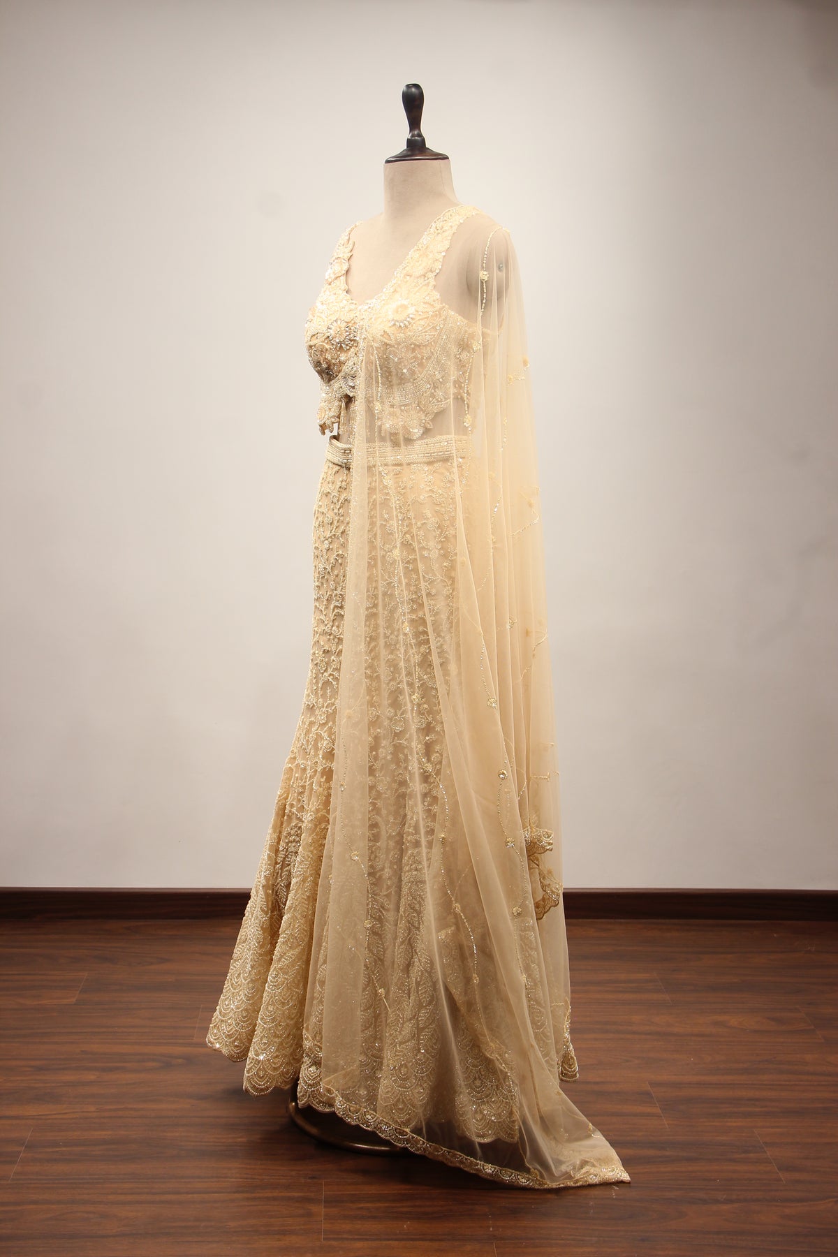 Net Mermaid Lehenga with Sequin & Cut Dana Handwork and Floral Bodice in Gold – side view