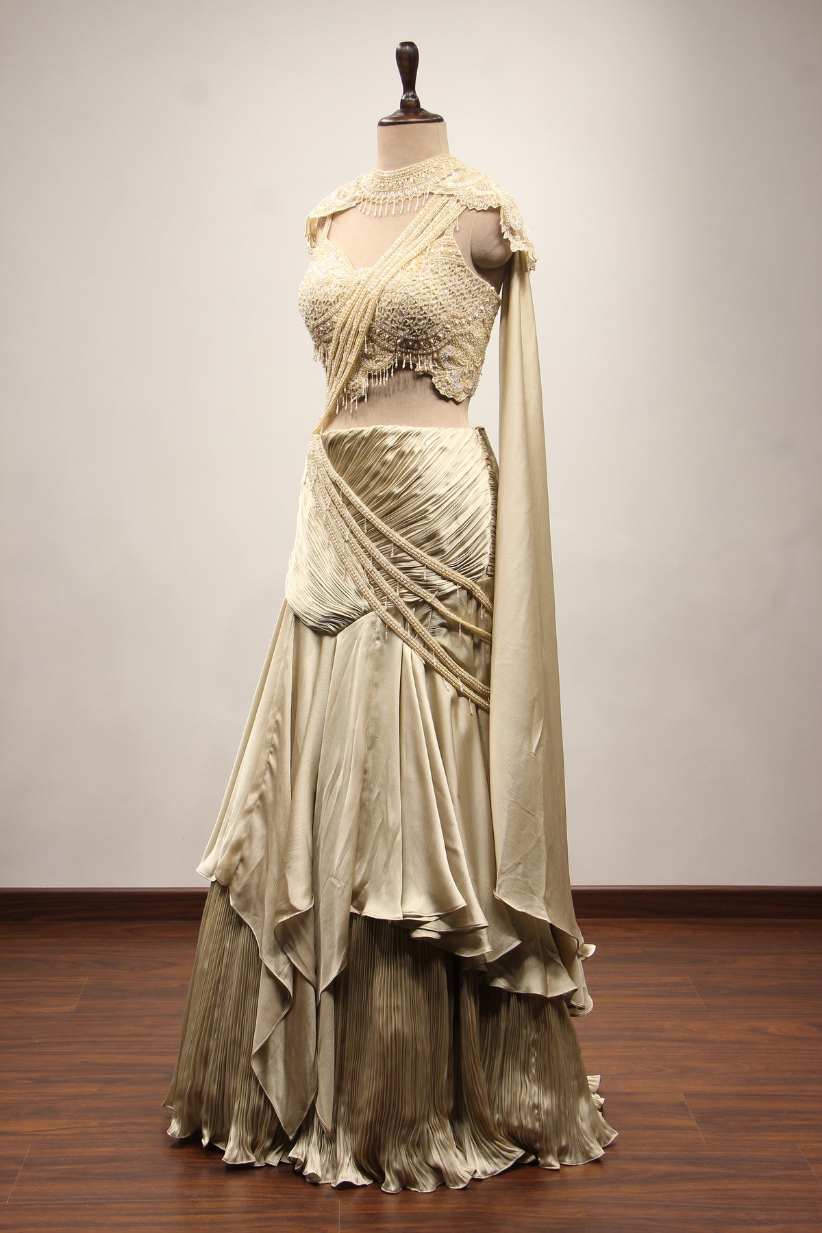 Ivory Satin Drape Skirt Lehenga with Bead & Pearl Handwork Crop Top – side view, with cape