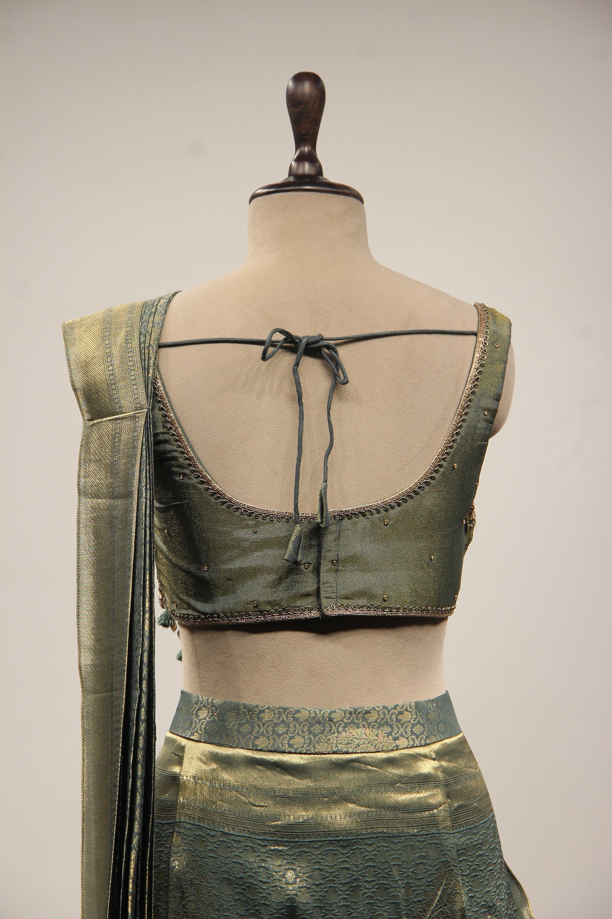 Banarasi Brocade Drape Saree with Zardozi & Cut Dana Handwork Corset in Green – back close-up