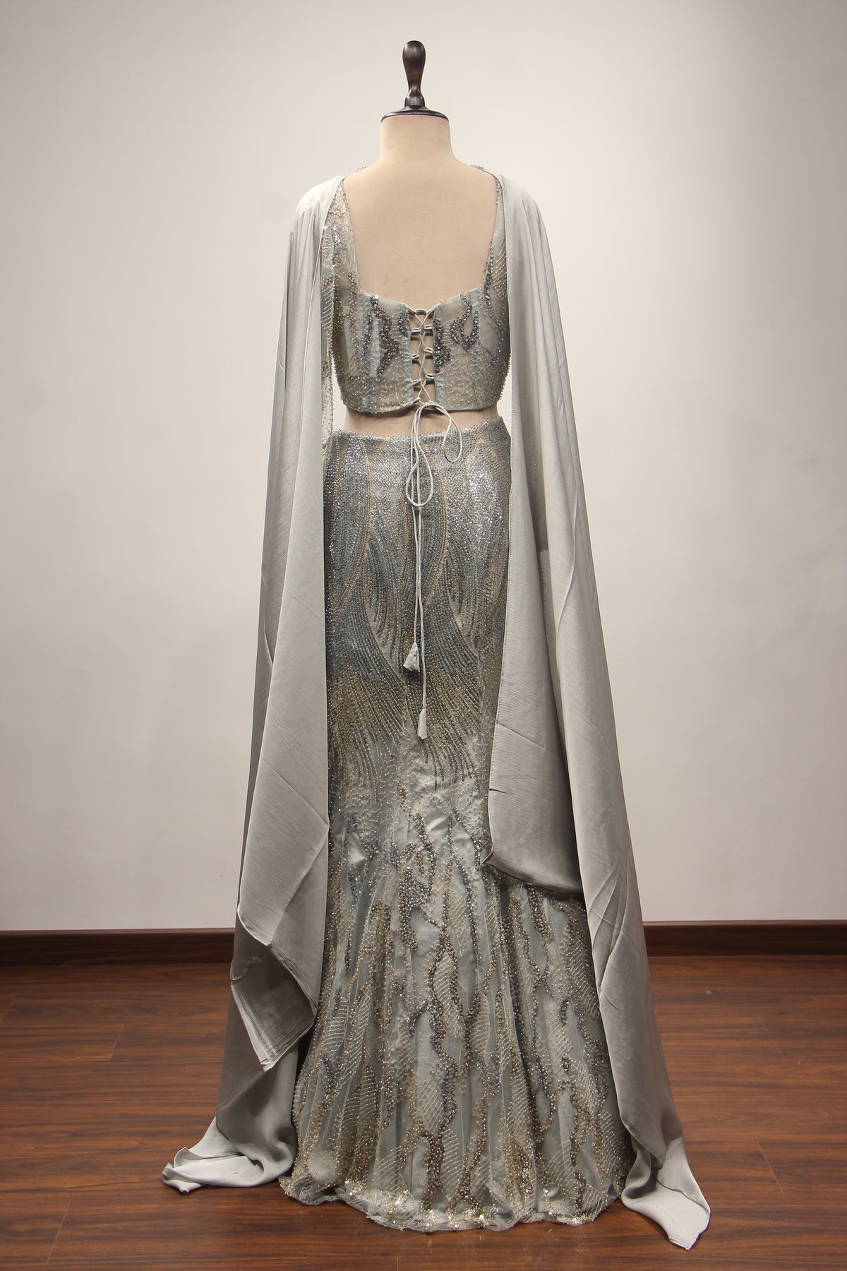 Grey Net Mermaid Lehenga with Cut Dana & Sequin Handwork Bustier – back view