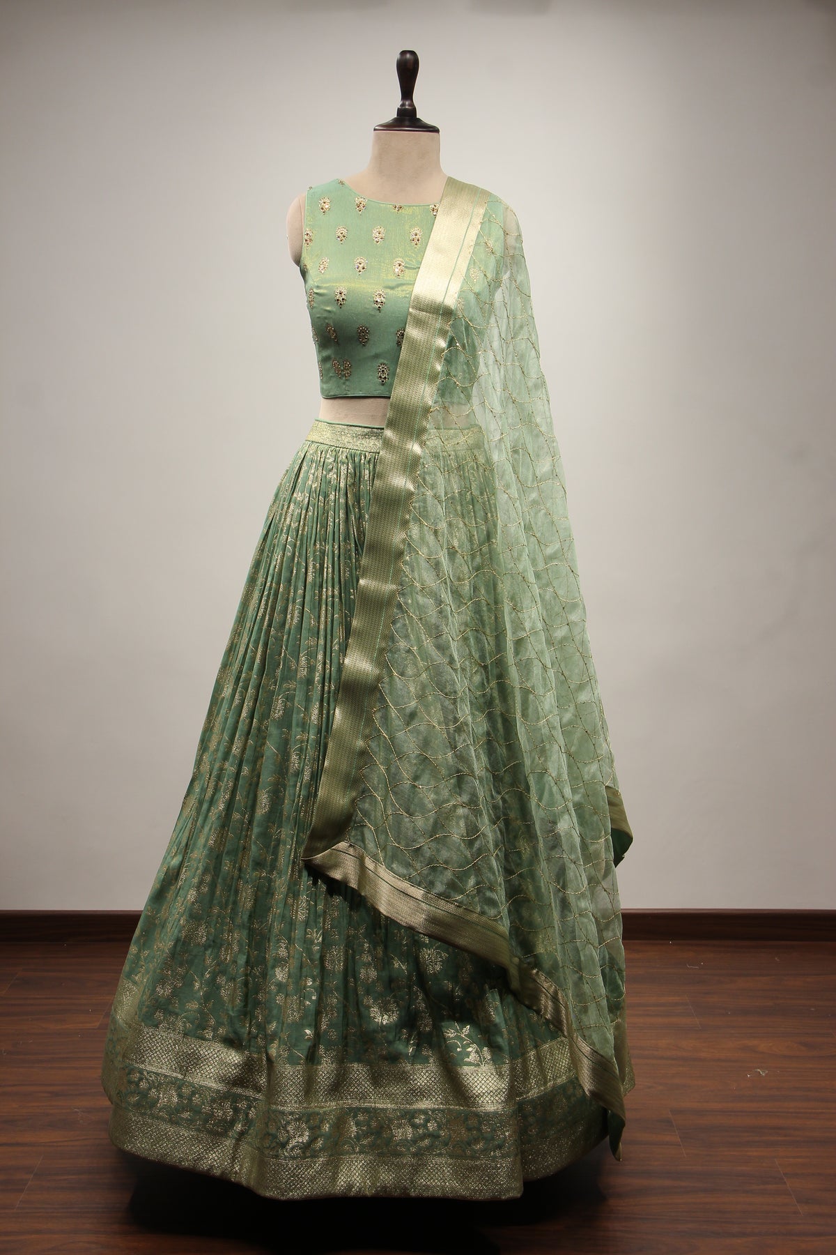 Green Banarsi Brocade Lehenga with Stone & Tassel Handwork Halter Neck