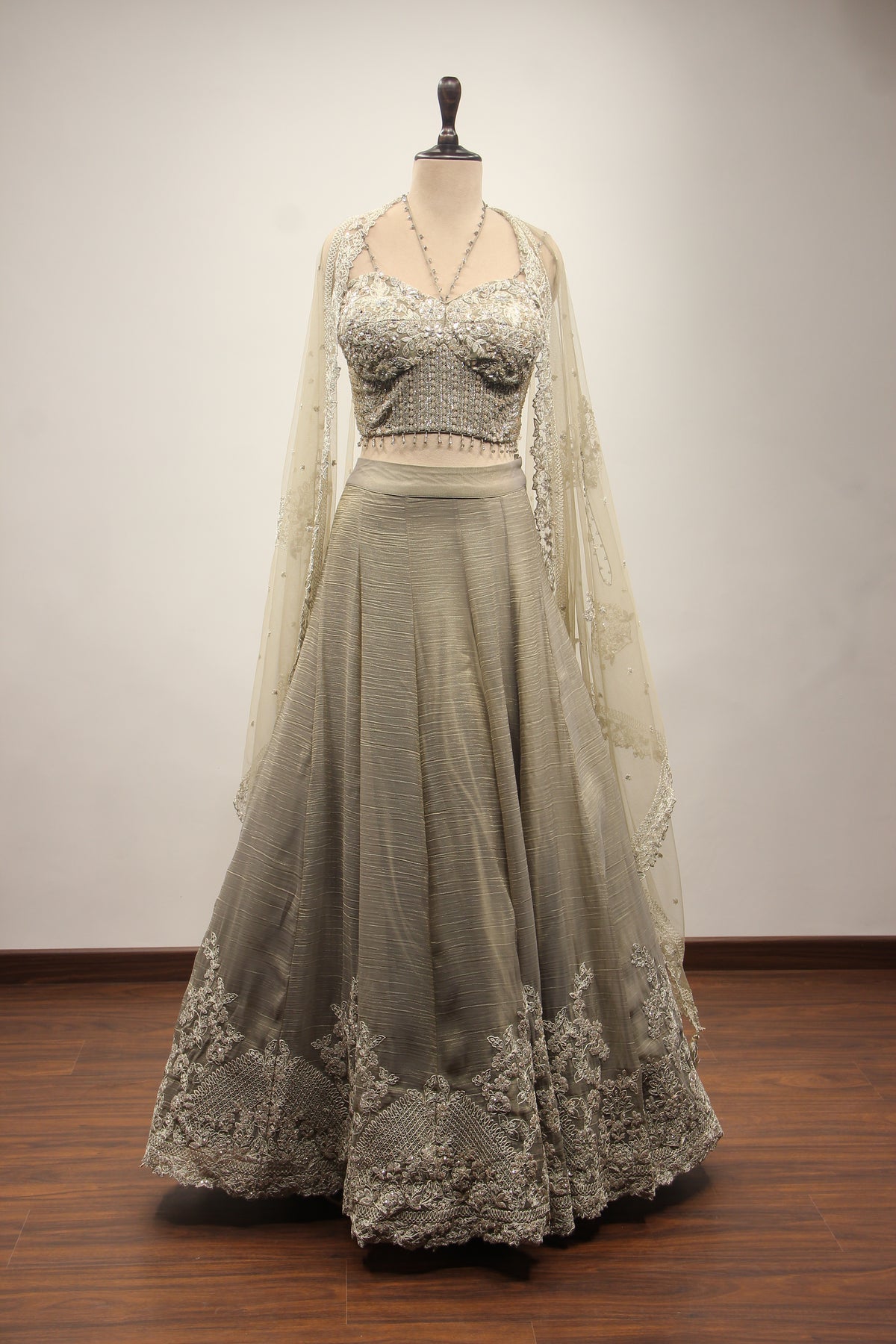 Grey Tissue Corset Lehenga with Sequin & Stone Handwork and Net Shrug – front view, with shrug
