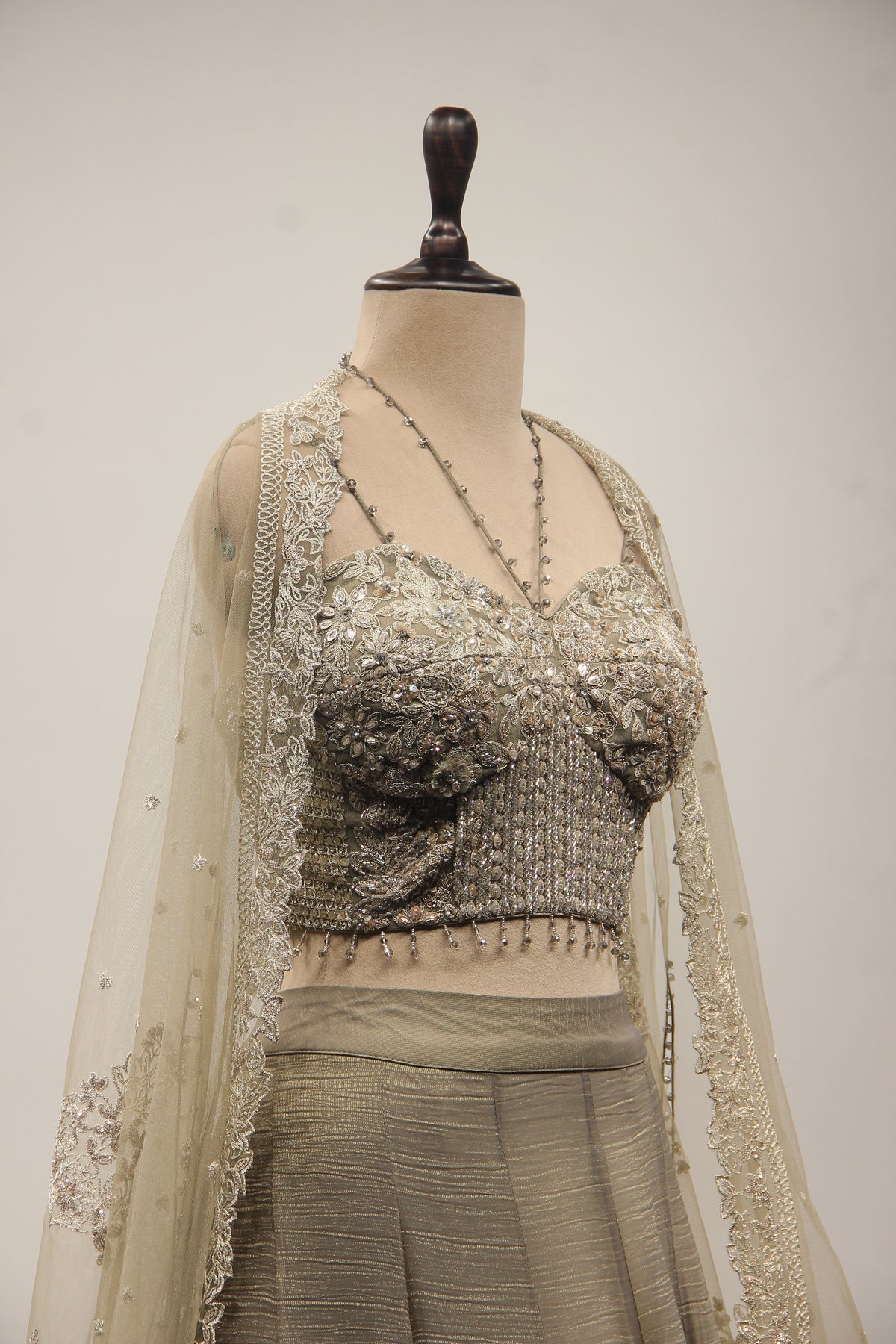 Grey Tissue Corset Lehenga with Sequin & Stone Handwork and Net Shrug – other side close-up, with shrug