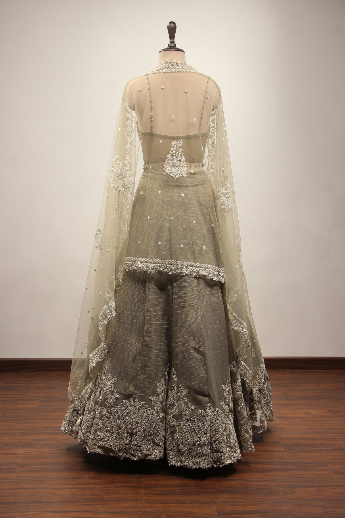 Grey Tissue Corset Lehenga with Sequin & Stone Handwork and Net Shrug – back view, with shrug