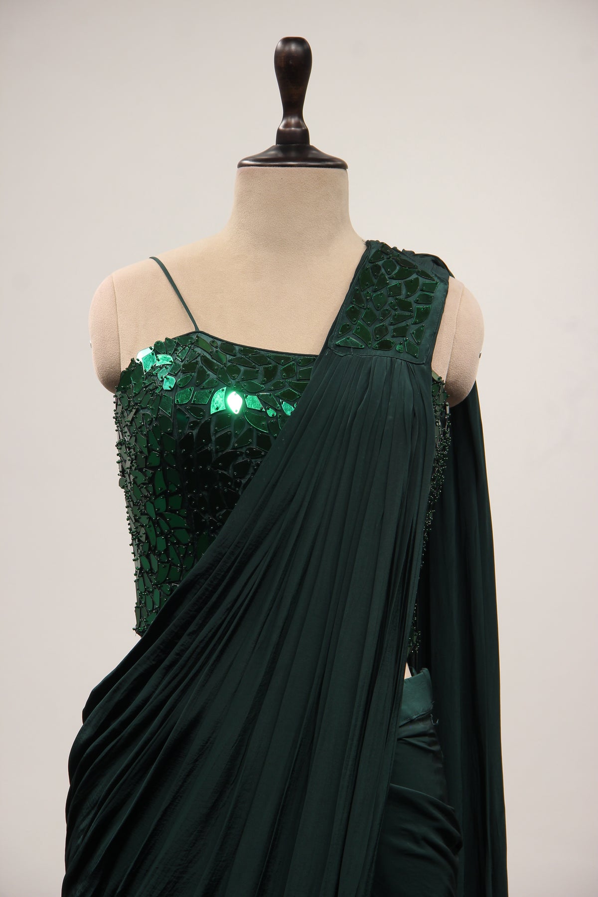 Bottle Green Crepe Drape Saree with Mirror & Bead Handwork Corset – front close-up