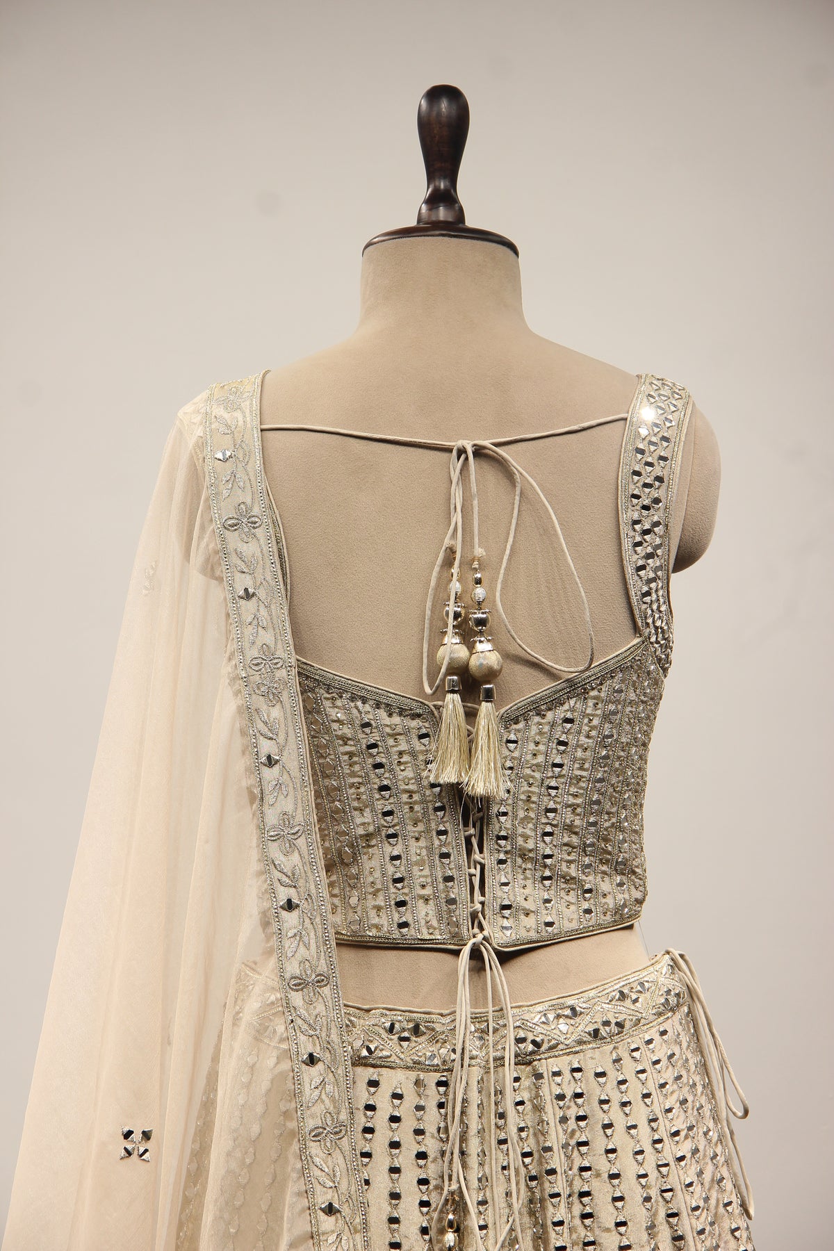 Grey Tissue Lehenga with Mirror & Zari Handwork Sweetheart Corset – back close-up