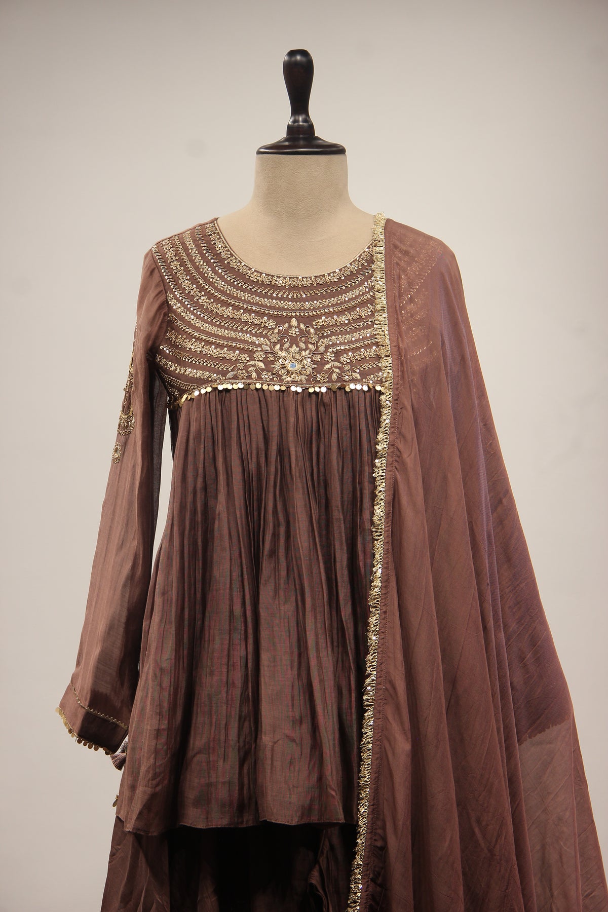 Chanderi Peplum Sharara Suit with Sequin & Zari Handwork Yoke in Brown – front close-up