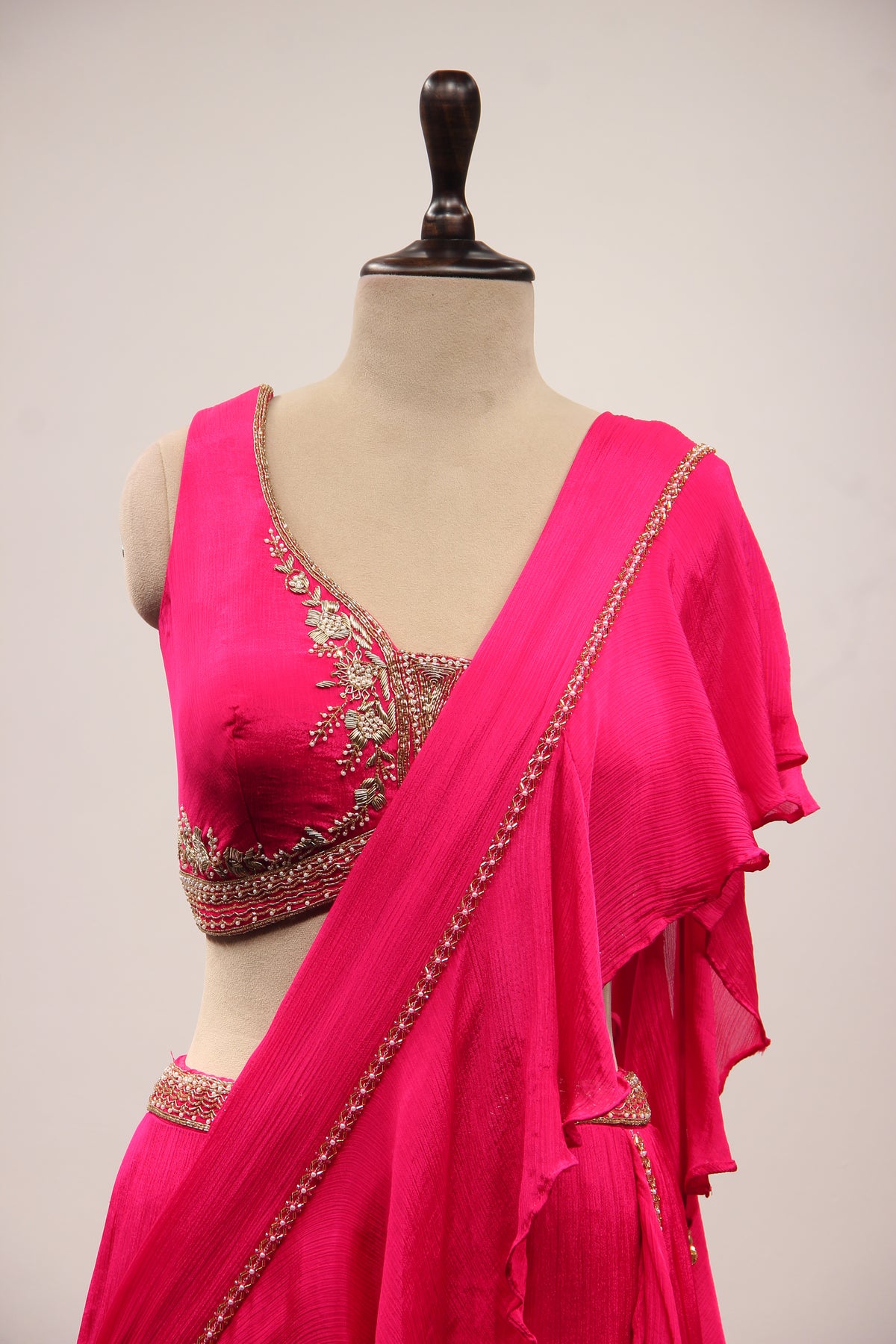 Crepe Ruffle Drape Saree with Zardozi & Bead Handwork V-Neck Crop Top in Pink – front close-up