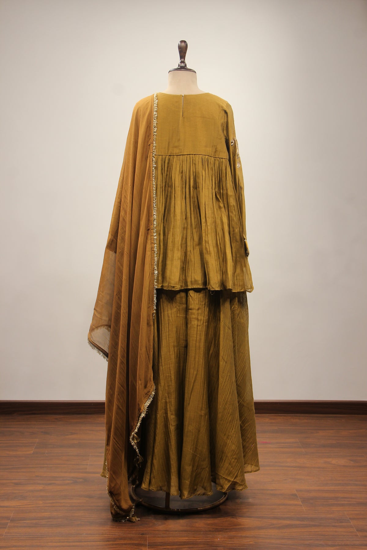 Chanderi Peplum Sharara Suit with Sequin & Zari Handwork Yoke in Green – back view