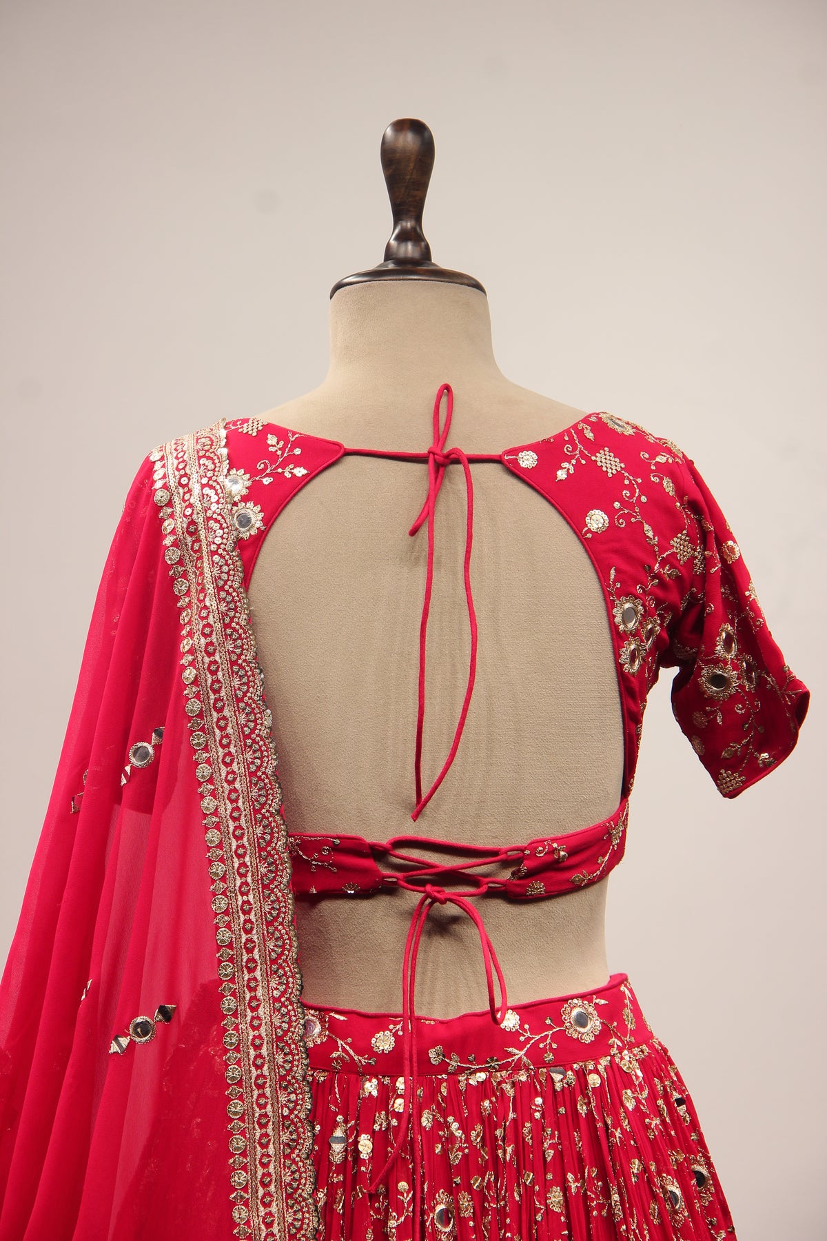 Georgette Lehenga with Mirror & Sequin Handwork Twist Front Crop Top in Red – back close-up