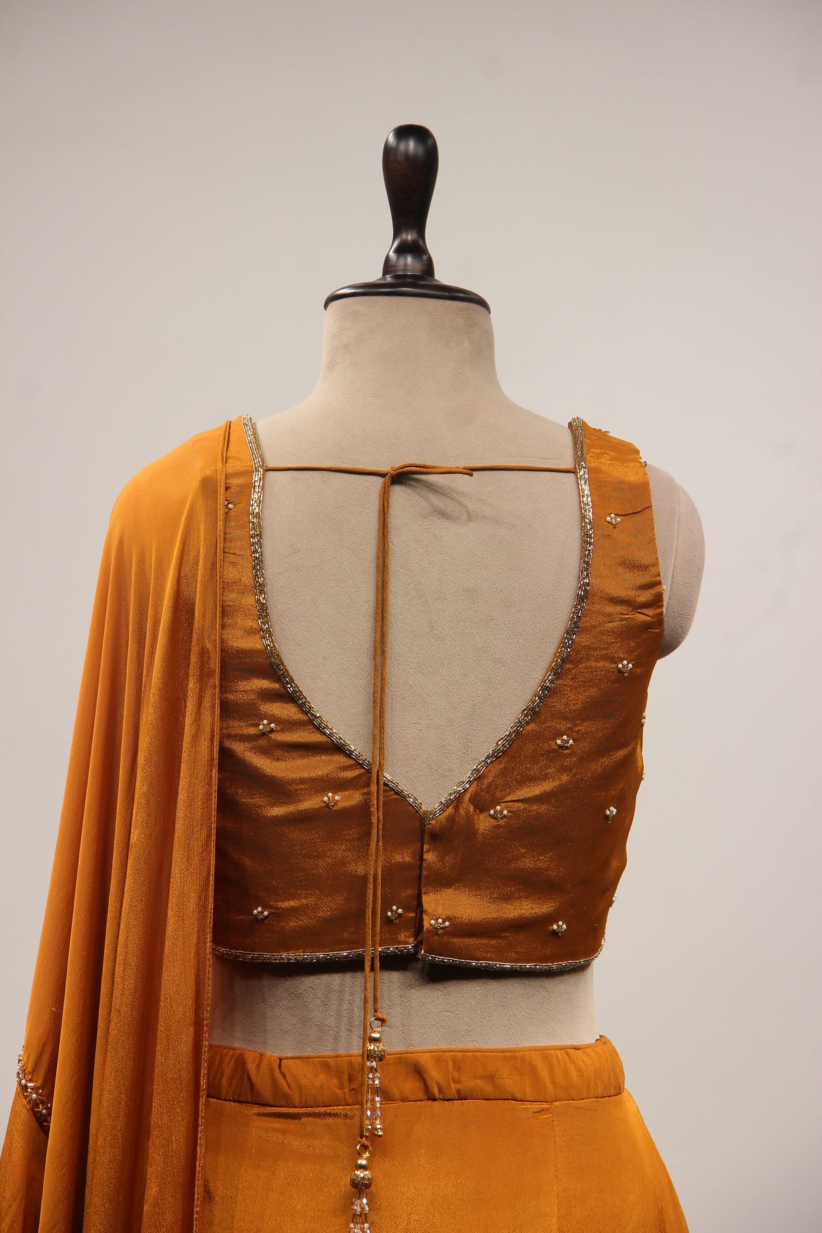 Crepe Ruffle Drape Saree with Zardozi & Bead Handwork V-Neck Crop Top in Yellow – back close-up