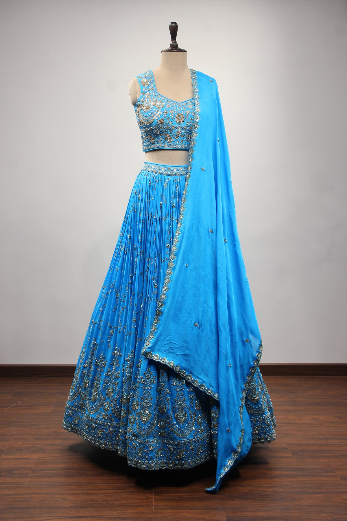 Turquoise Crepe Crop Top Lehenga in Hand Embroidery & Zardozi Handwork – front view