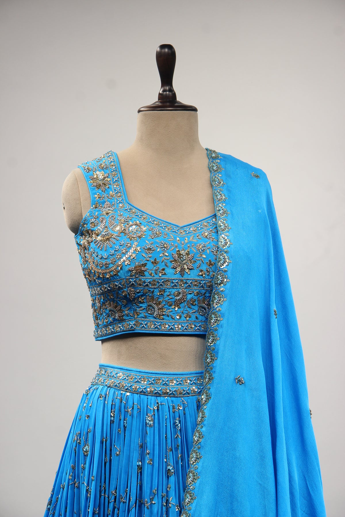 Turquoise Crepe Crop Top Lehenga in Hand Embroidery & Zardozi Handwork – front close-up