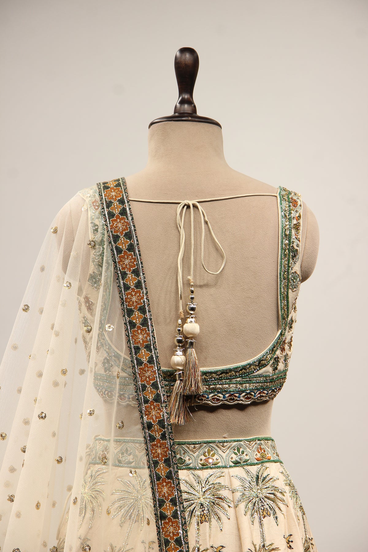 Beige Palm Printed Silk Lehenga with Hand Embroidery Crop Top – back close-up