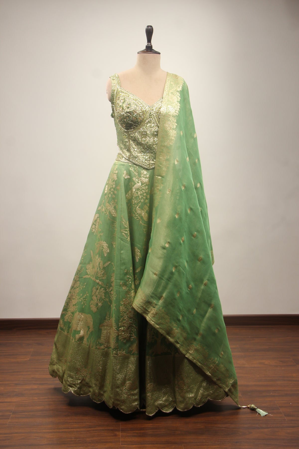 Green Banarasi Brocade Lehenga with Zardozi & Cut Dana Handwork Corset – front view