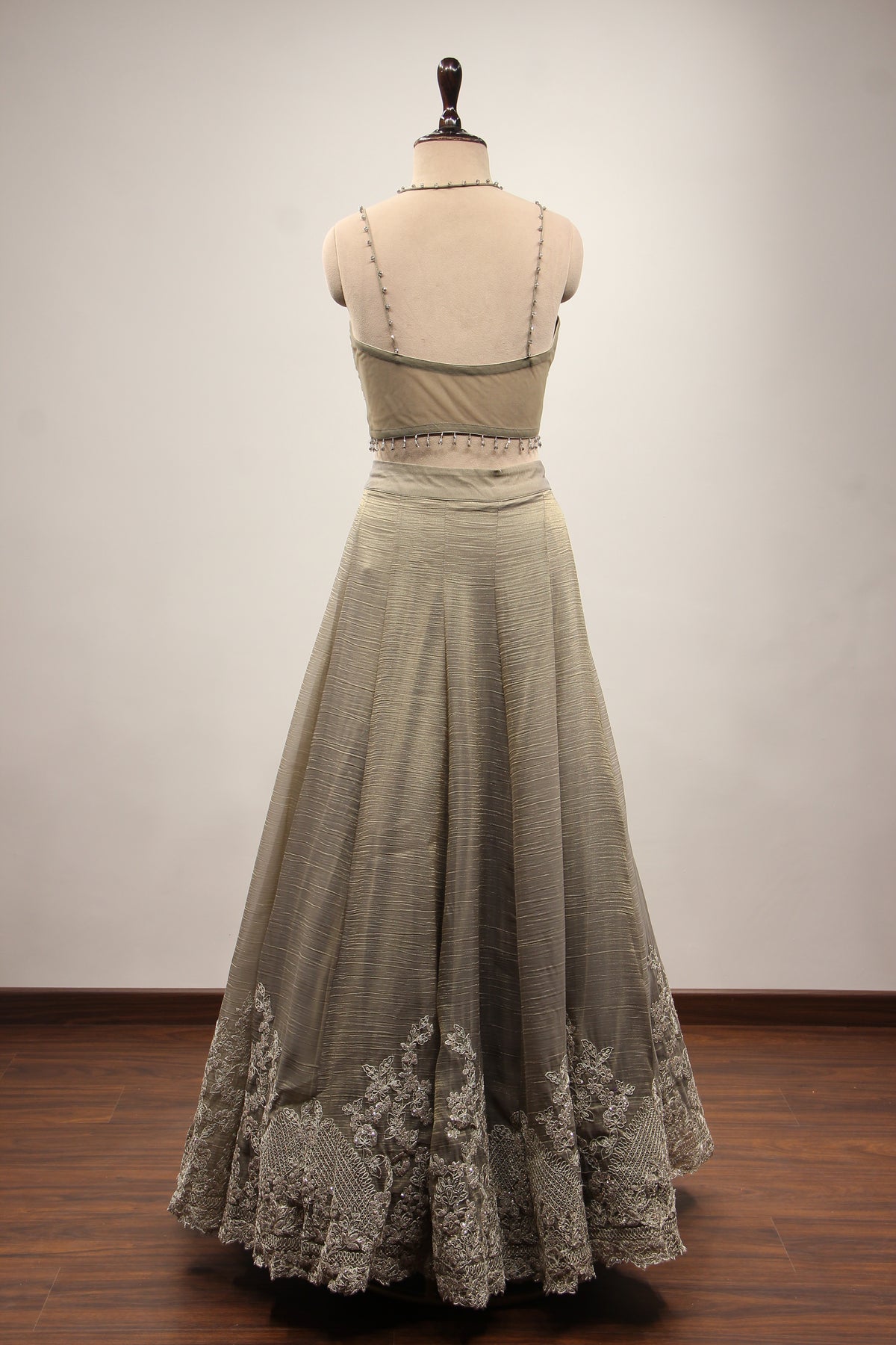 Grey Tissue Corset Lehenga with Sequin & Stone Handwork and Net Shrug – back view, without shrug