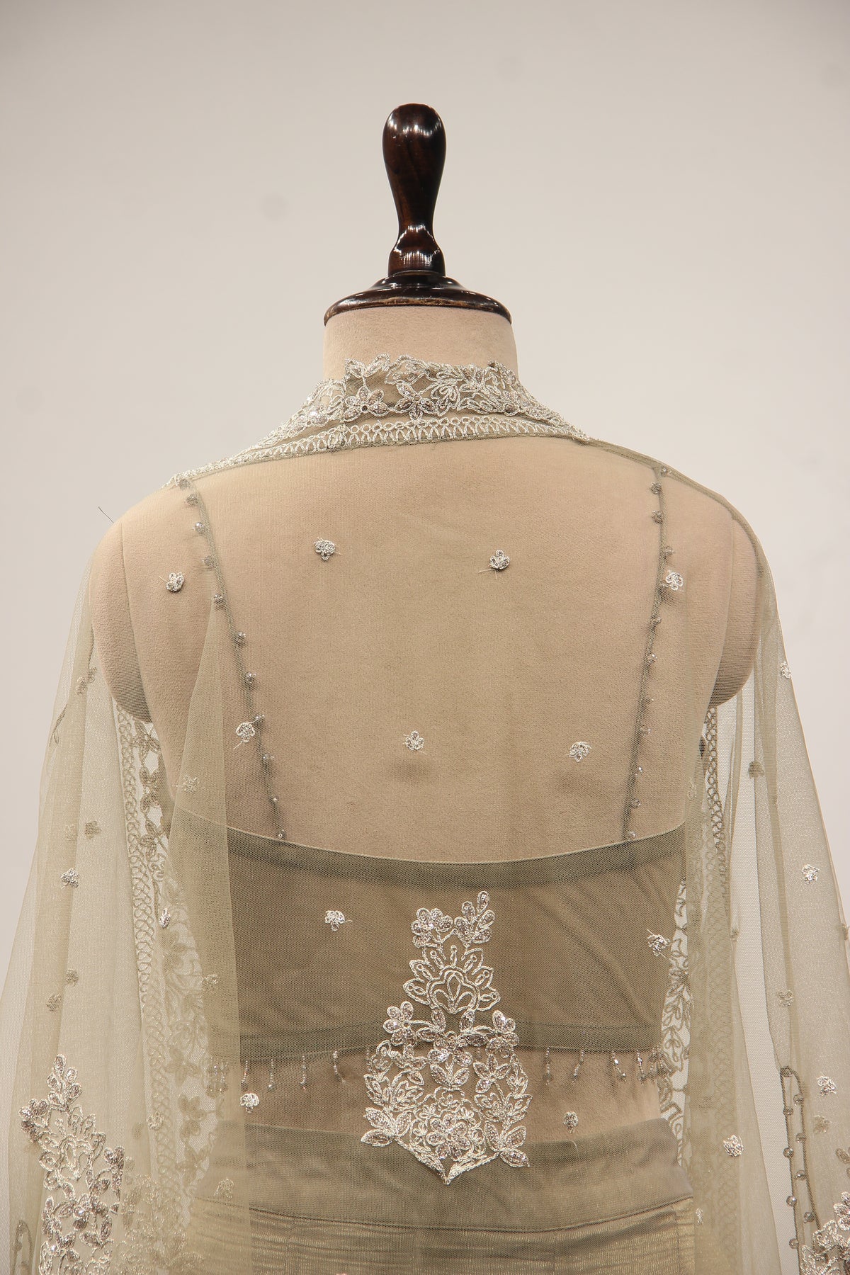 Grey Tissue Corset Lehenga with Sequin & Stone Handwork and Net Shrug – back close-up, with shrug