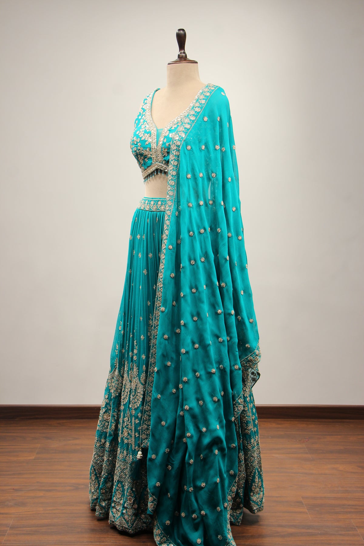 Georgette Lehenga with Zari & Sequin Handwork Plunge V-Neck Crop Top in Green – side view