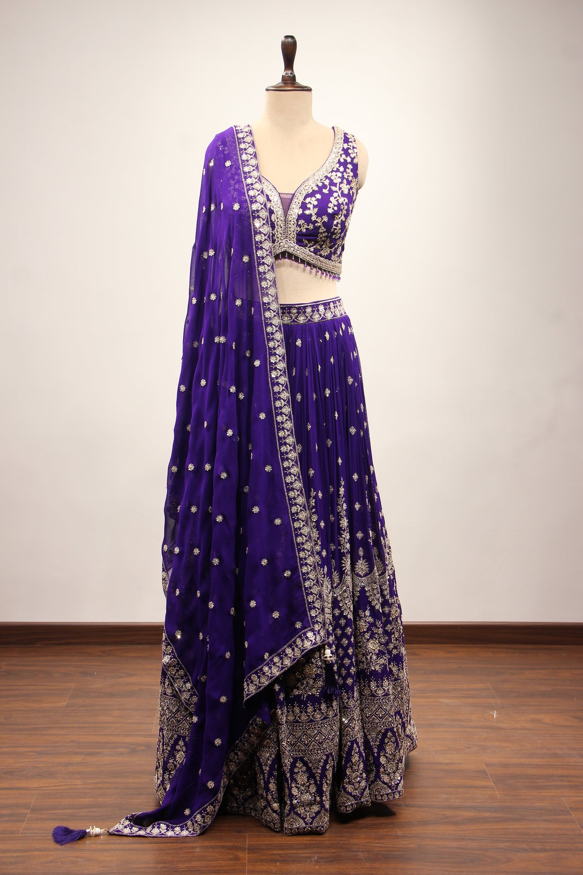 Georgette Lehenga with Zari & Sequin Handwork Plunge V-Neck Crop Top in Purple – front view