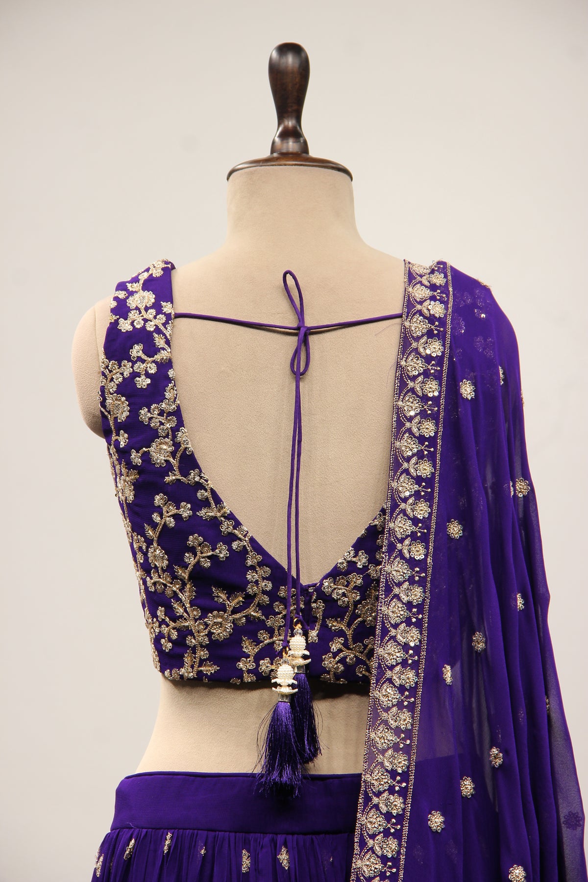 Georgette Lehenga with Zari & Sequin Handwork Plunge V-Neck Crop Top in Purple – back close-up