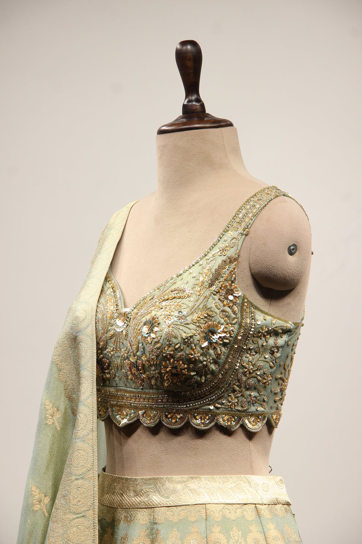 Pista Green Banarasi Brocade Lehenga with Hand Embroidery & Cut Dana – side close-up