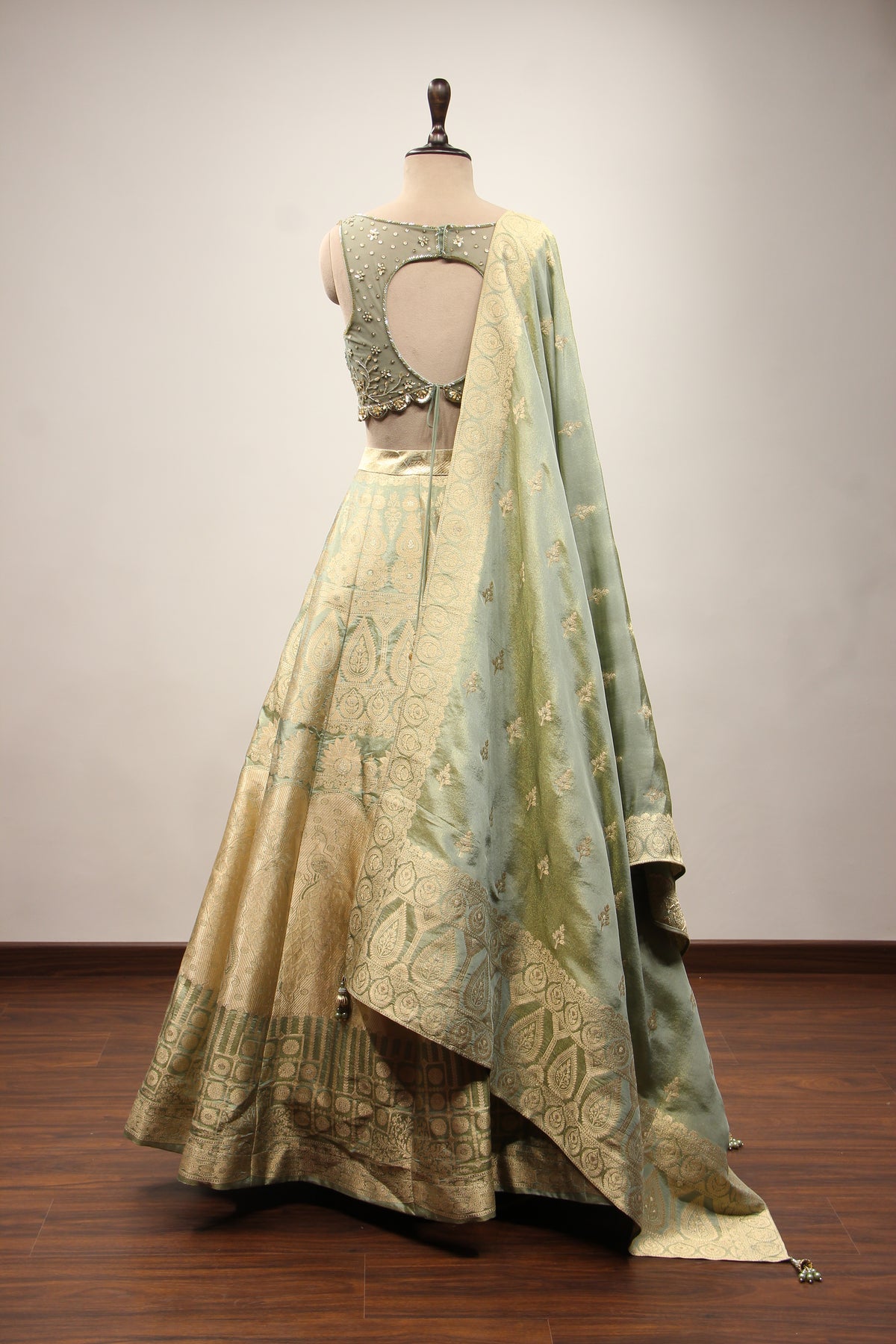 Pista Green Banarasi Brocade Lehenga with Hand Embroidery & Cut Dana – back view