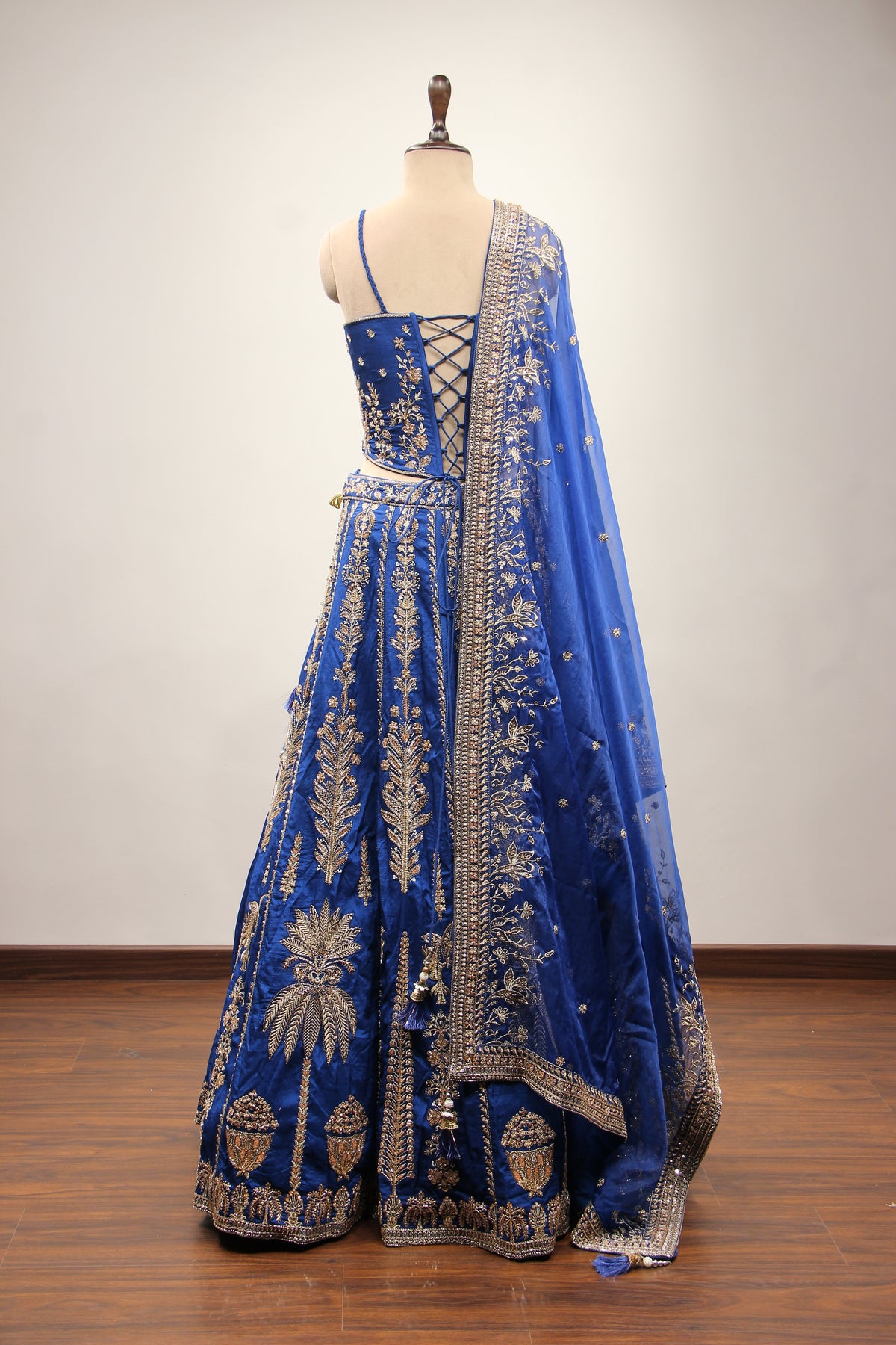 Royal Blue Dupion Lehenga with Corset Blouse, Zari & Cut Dana Handwork in Blue – back view