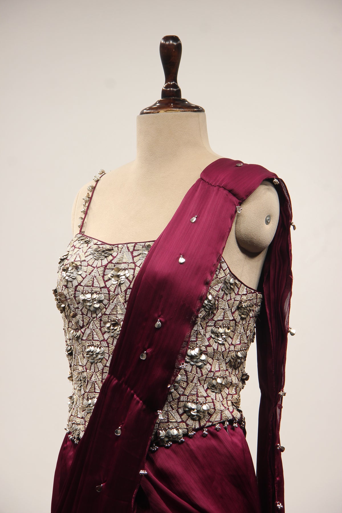 Wine Crepe Drape Saree with Zari & Sequin Handwork Strappy Corset – side close-up