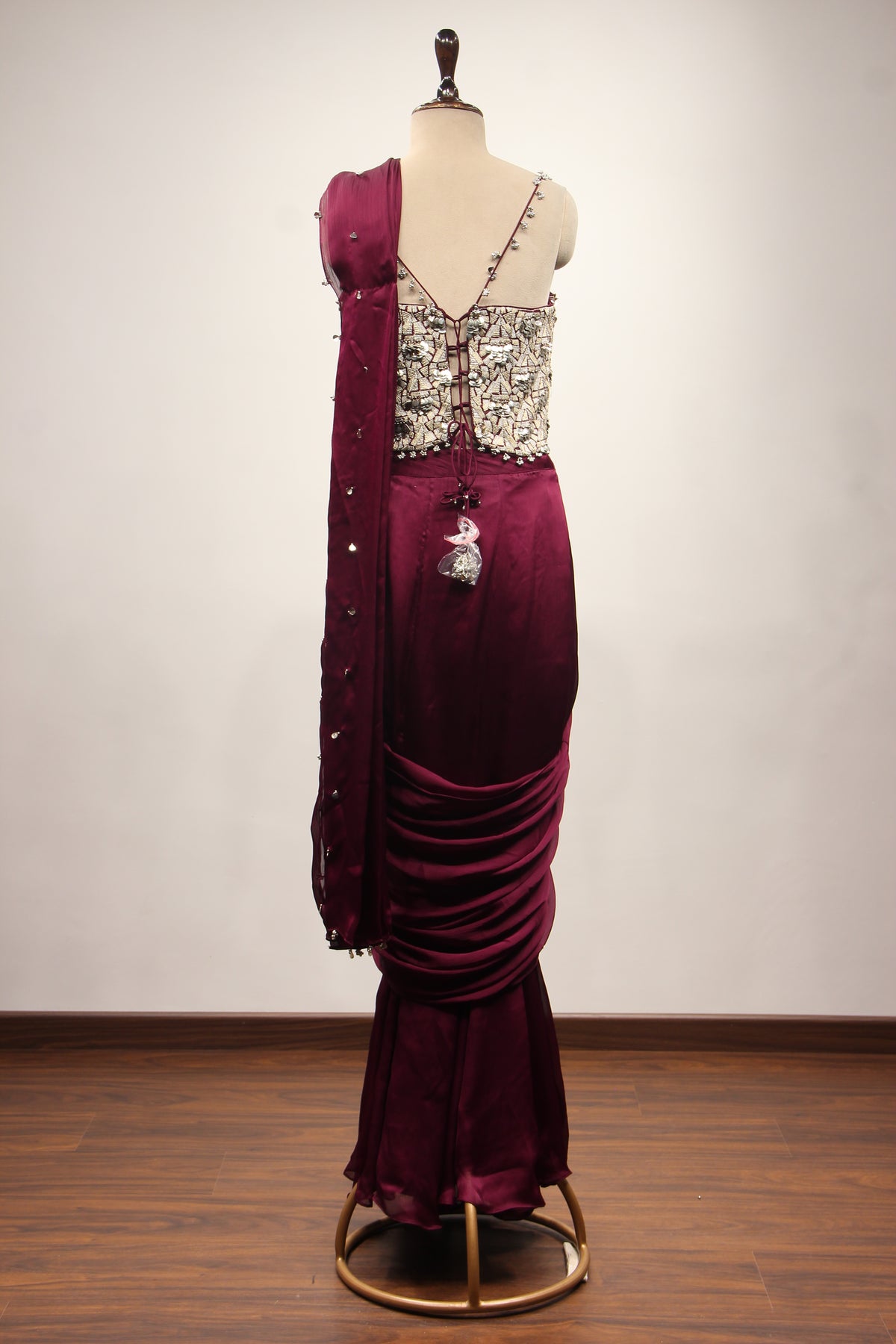Wine Crepe Drape Saree with Zari & Sequin Handwork Strappy Corset – back view