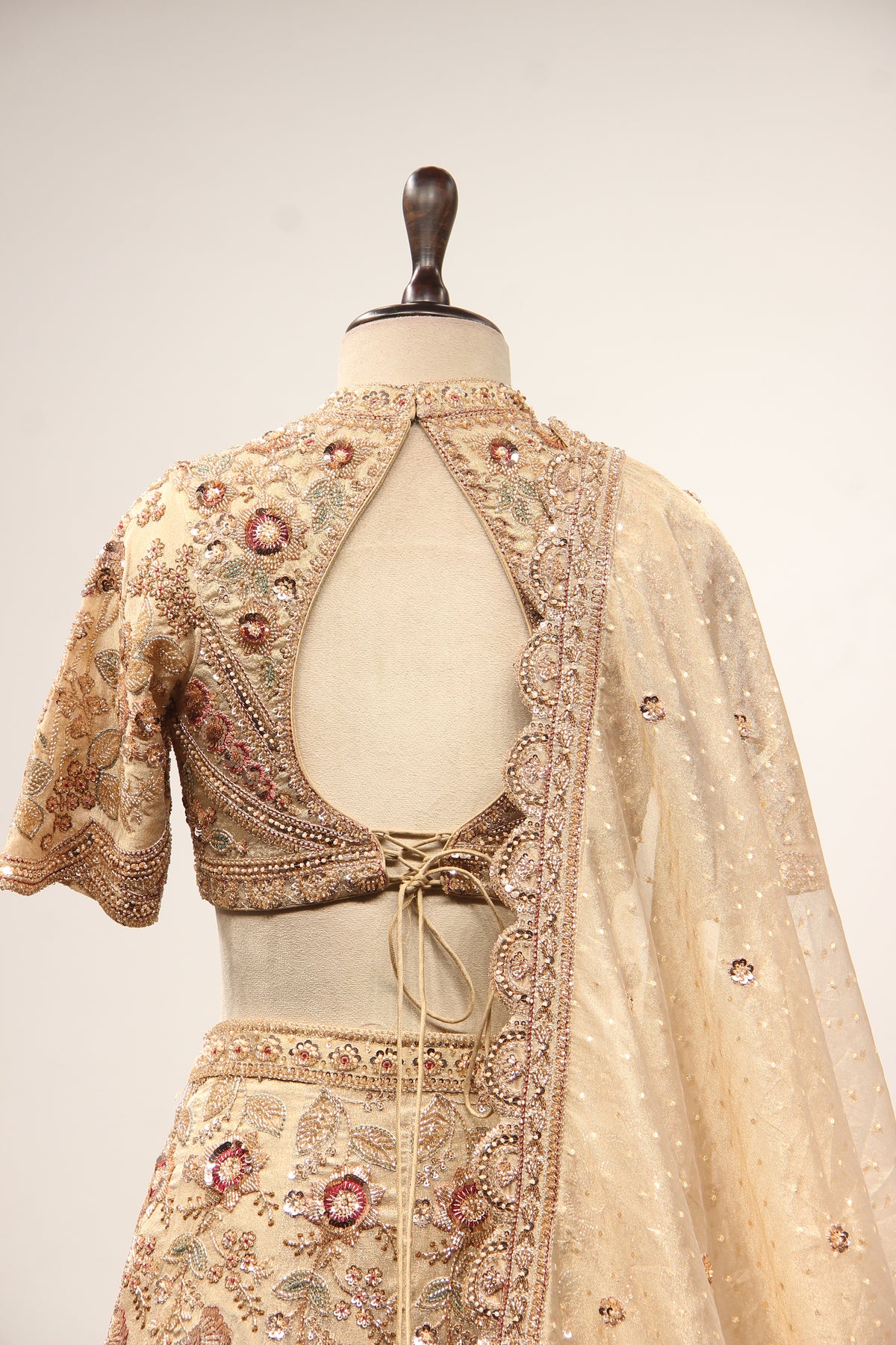 Gold Tissue Lehenga with Resham & Sequin Handwork Half Sleeve Crop Top – back close-up