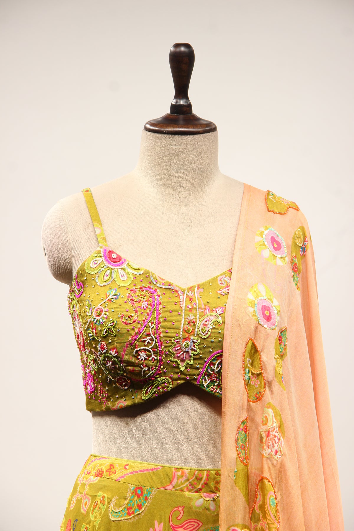 Mehendi Organza Lehenga with Printed & Cut Dana Handwork Strappy Top – front close-up