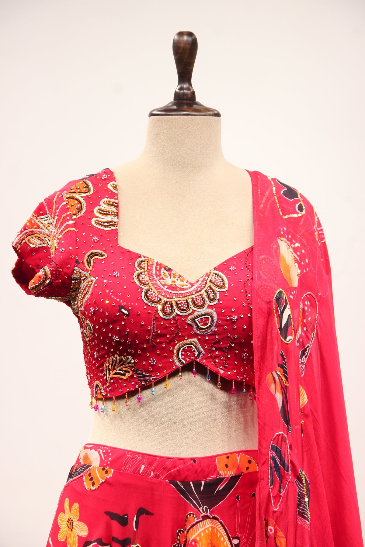 Red Organza Lehenga with Printed & Cut Dana Handwork Cap Sleeve Top – front close-up