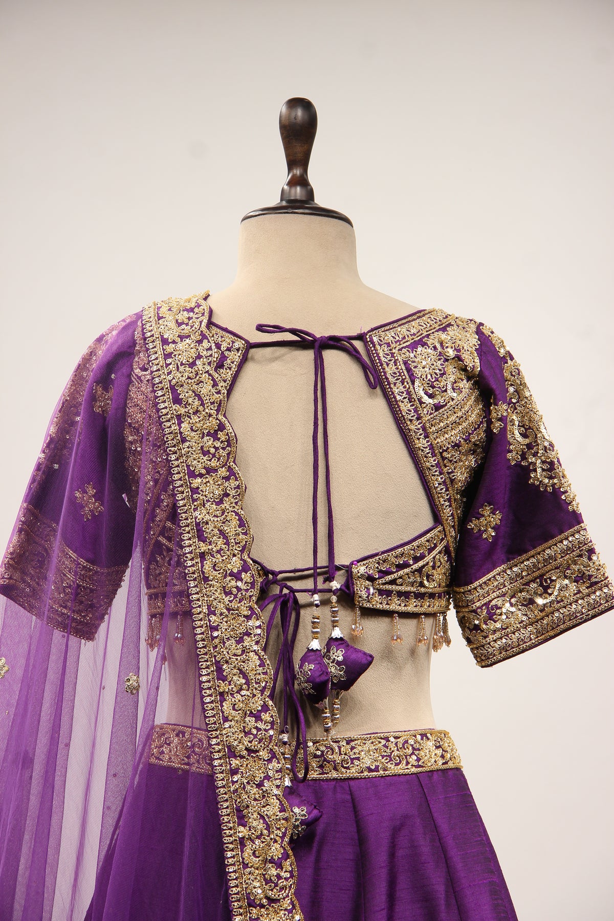 Dupion Lehenga with Zari & Sequin Handwork Half Sleeve V-Neck Crop Top in Purple – back close-up