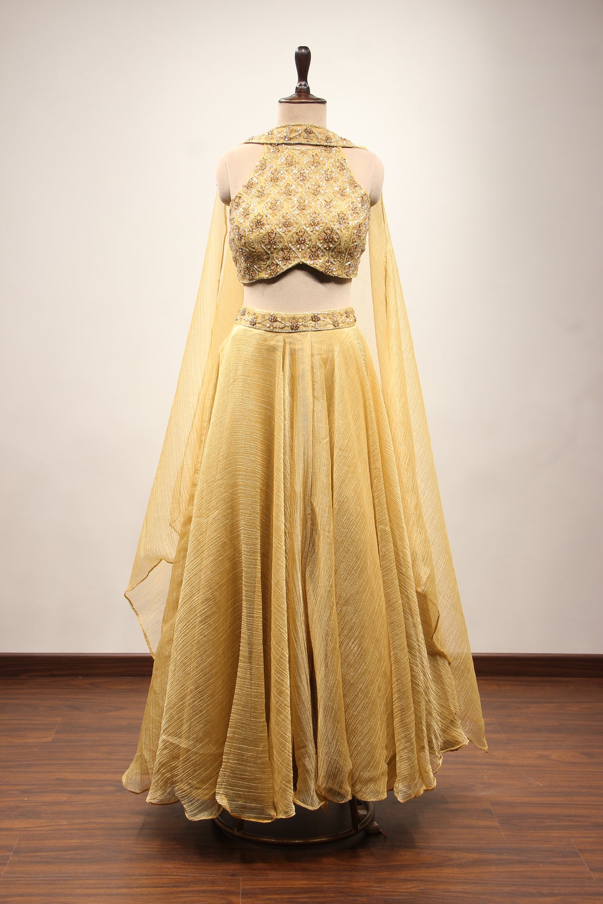 Gold Shimmer Tissue Halter Neck Lehenga with Cut Dana & Bead Handwork – front view