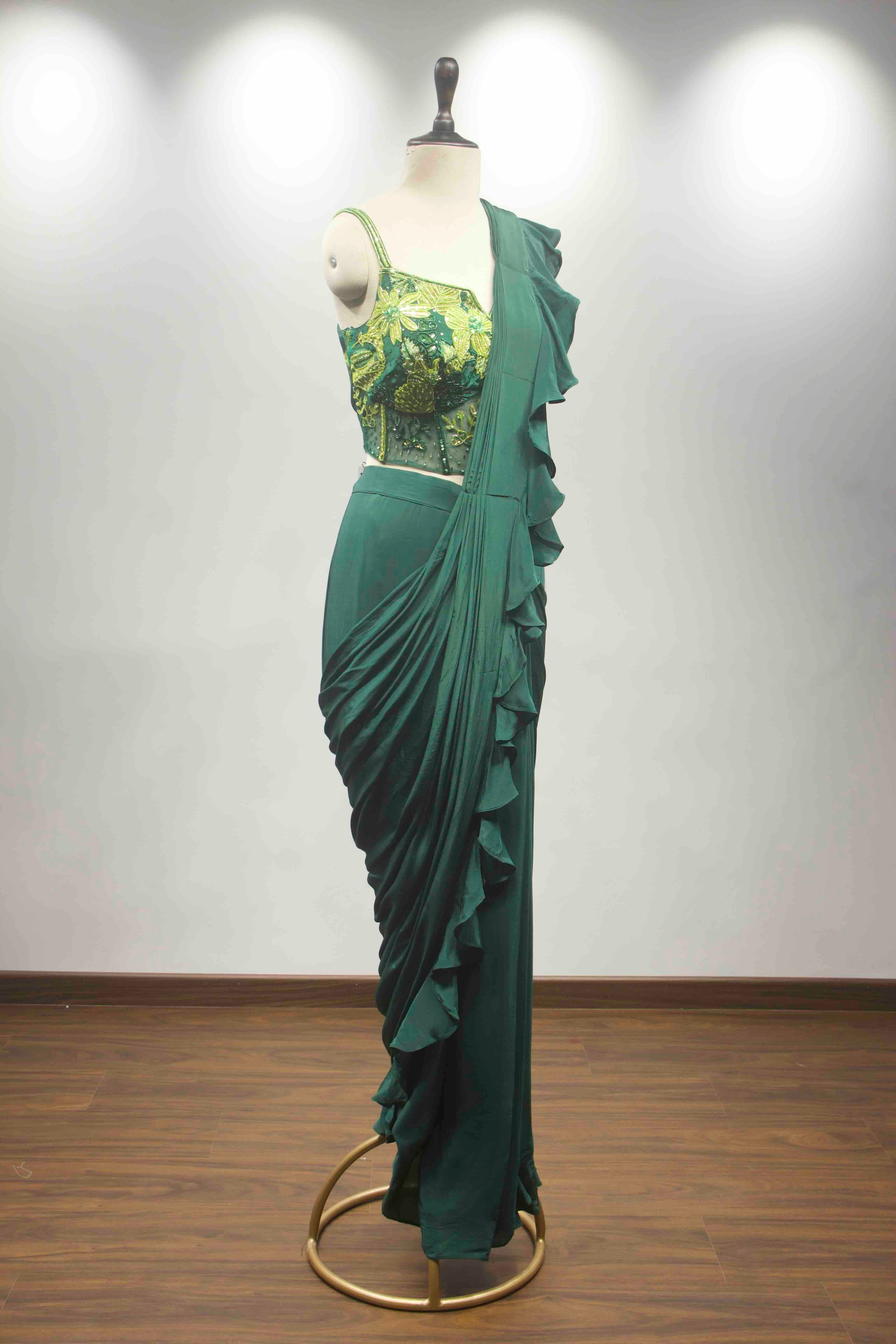 hand emb blouse green drape saree