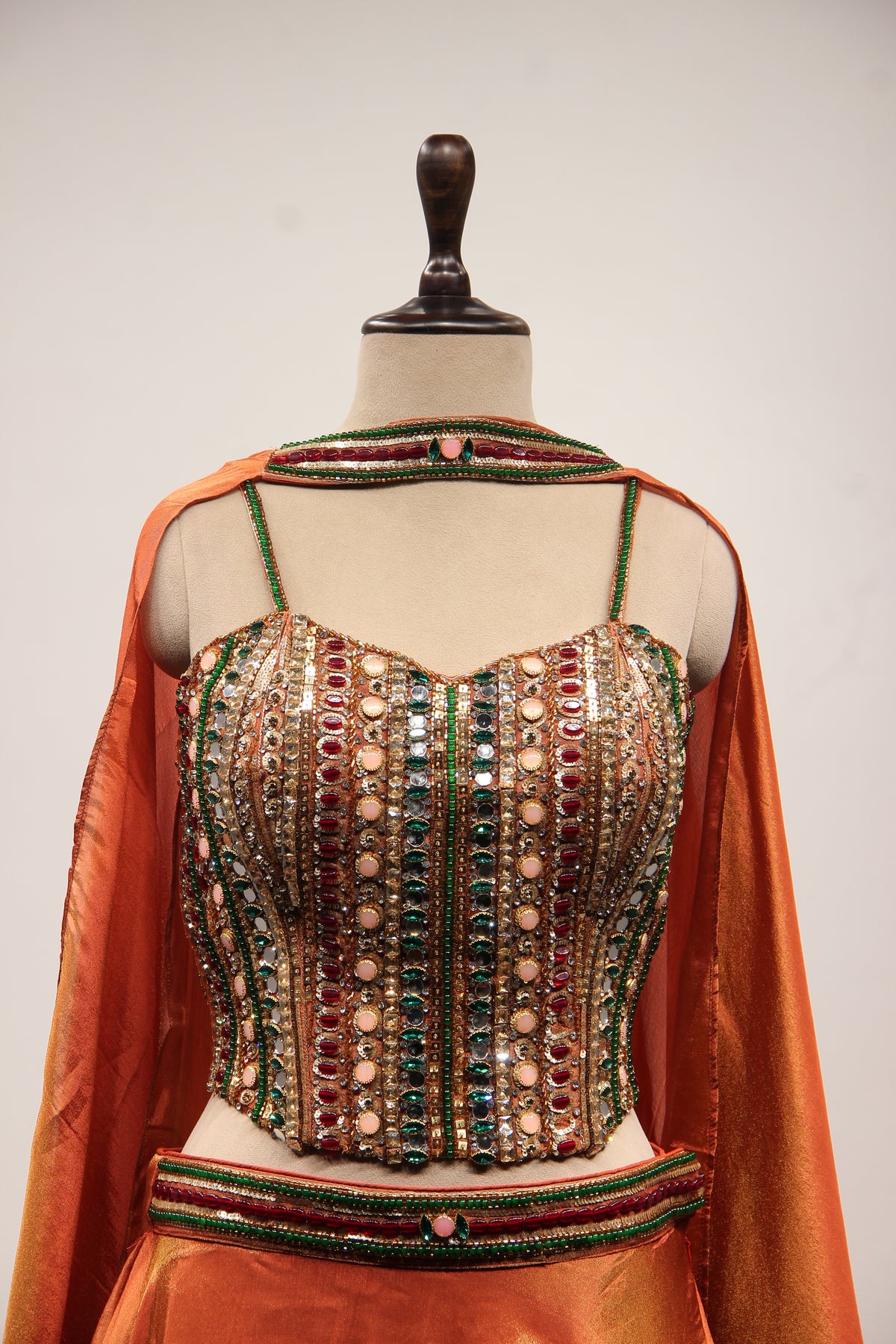 Rust Shimmer Tissue Corset Lehenga in Hand Embroidery & Stone Handwork – front close-up