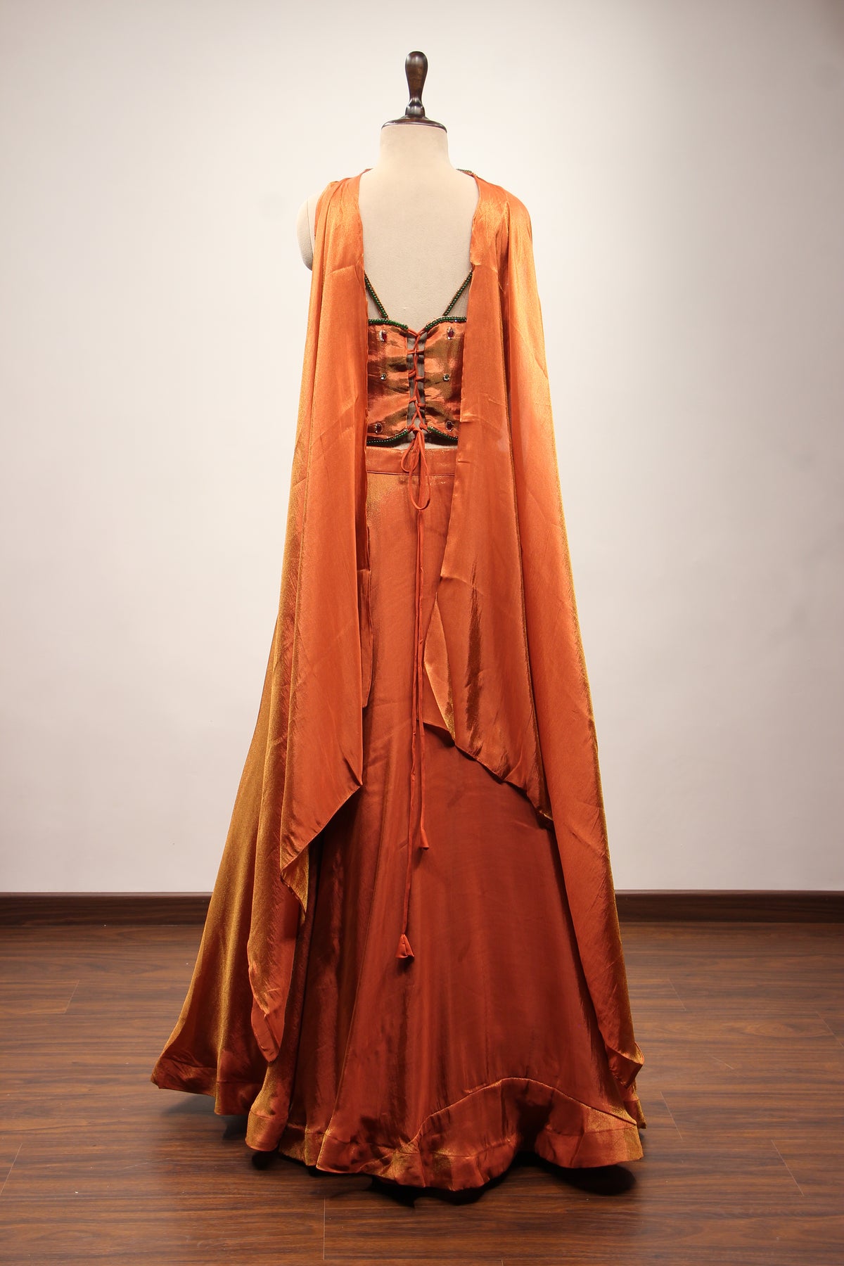 Rust Shimmer Tissue Corset Lehenga in Hand Embroidery & Stone Handwork – back view