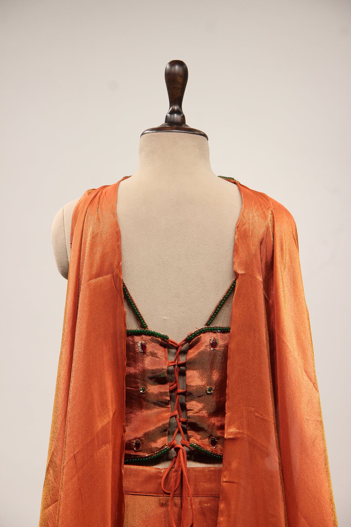 Rust Shimmer Tissue Corset Lehenga in Hand Embroidery & Stone Handwork – back close-up