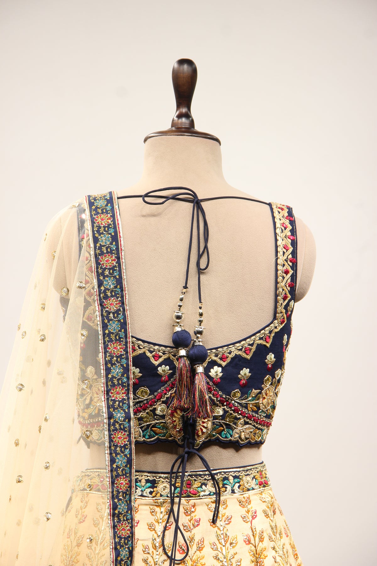 Ivory Ombre Dupion Corset Lehenga with Printed & Gota Patti Handwork – back close-up