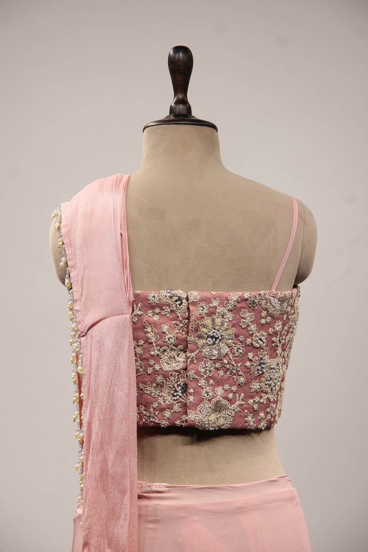 Baby Pink Crepe Drape Saree with Hand Embroidery & Resham Net Corset – back close-up